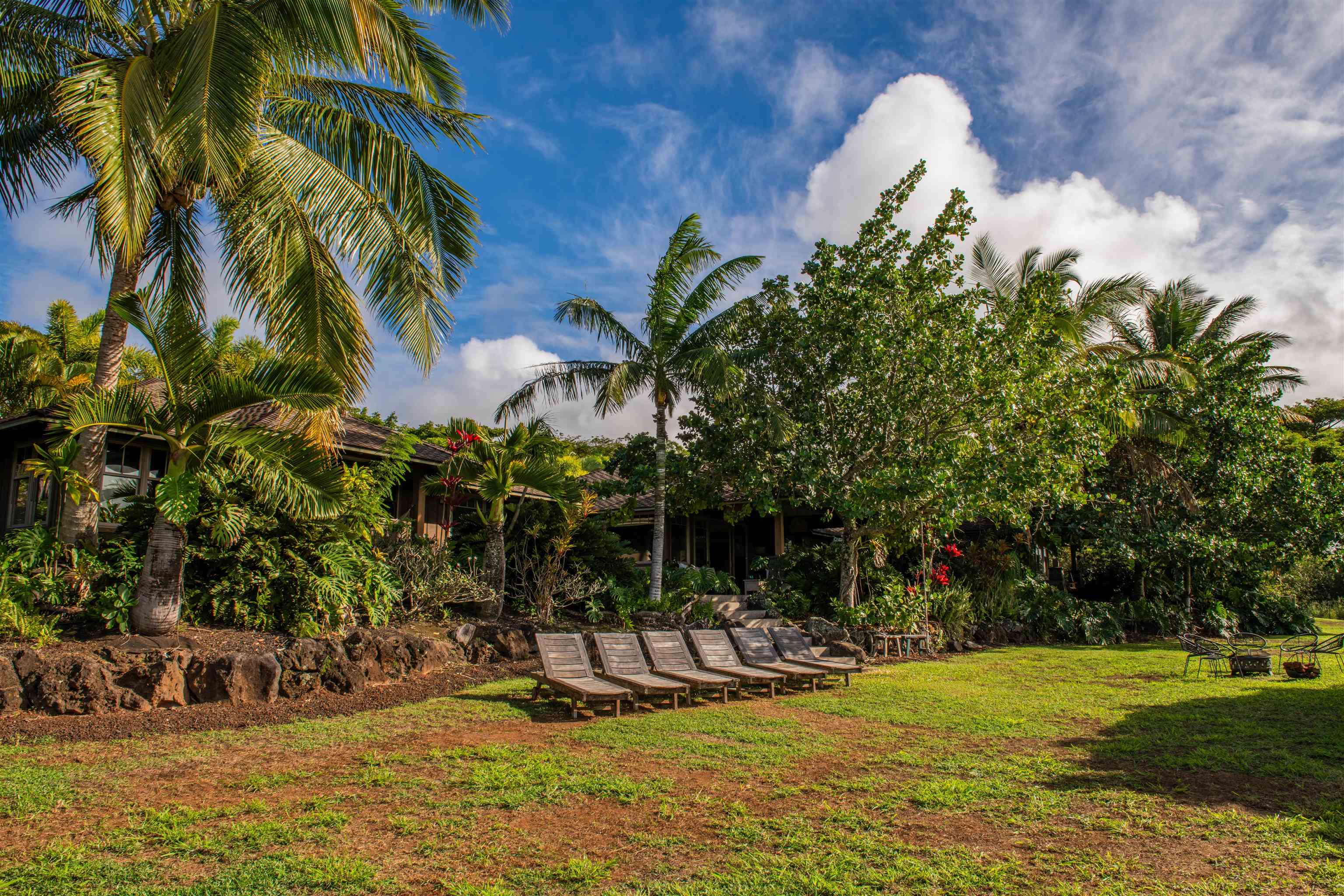 52 Papio Way, Unit A Haiku, HI 96708 - Photo 39 of 50 a view of a water fountain in front of a house