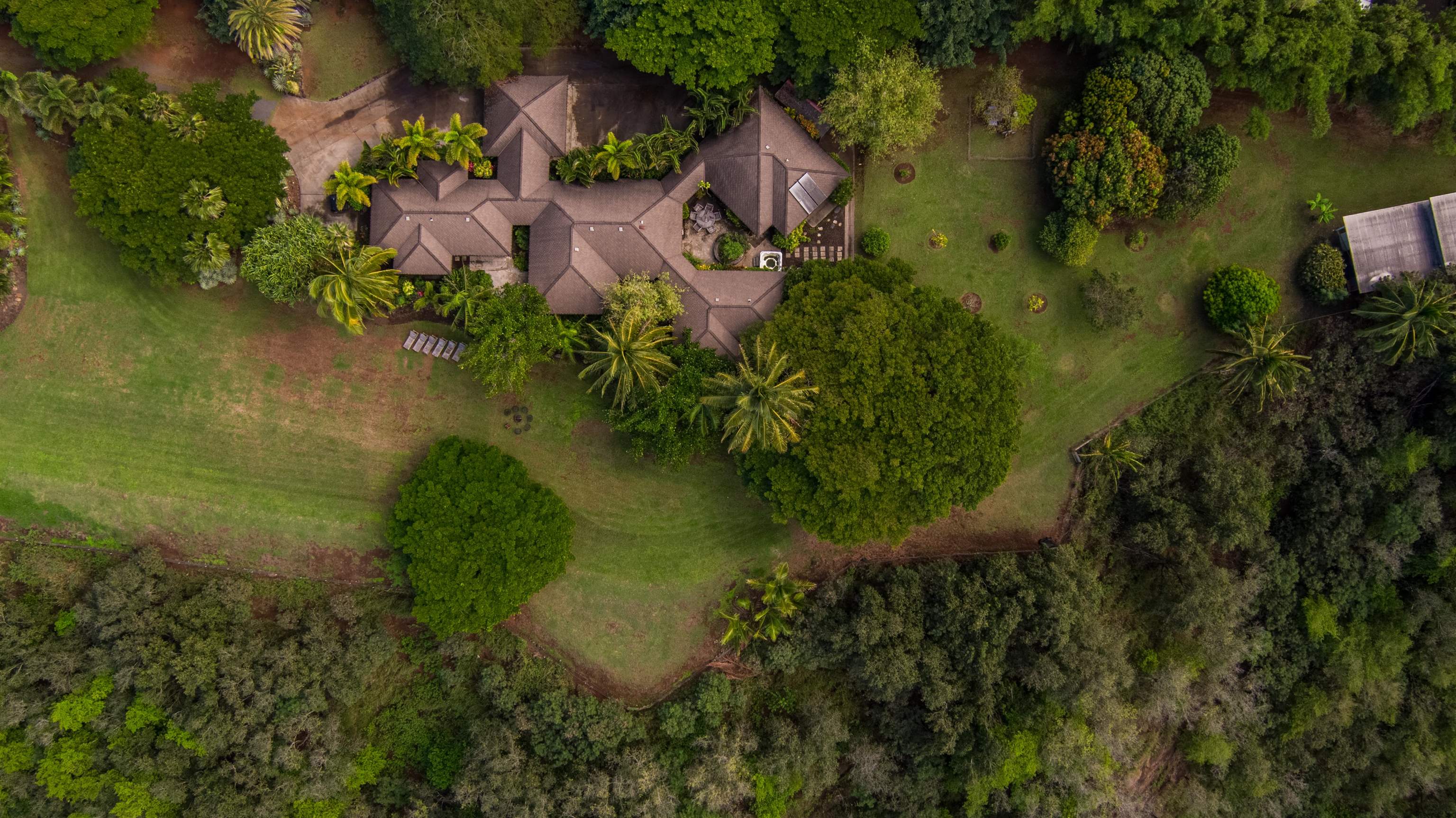52 Papio Way, Unit A Haiku, HI 96708 - Photo 4 of 50 an aerial view of residential house with outdoor space and river
