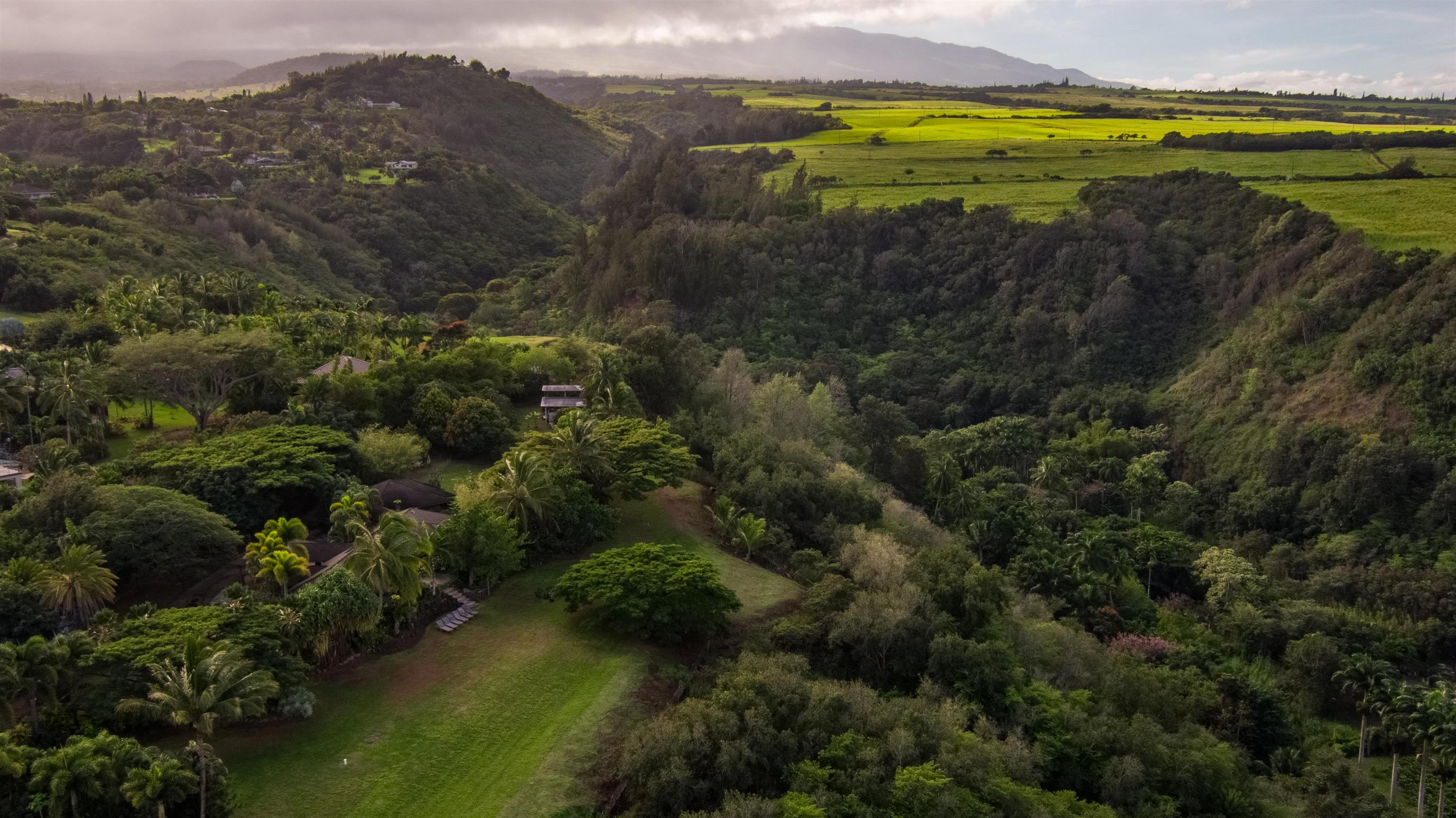 52 Papio Way, Unit A Haiku, HI 96708 - Photo 45 of 50 a view of a lake with mountains in the background