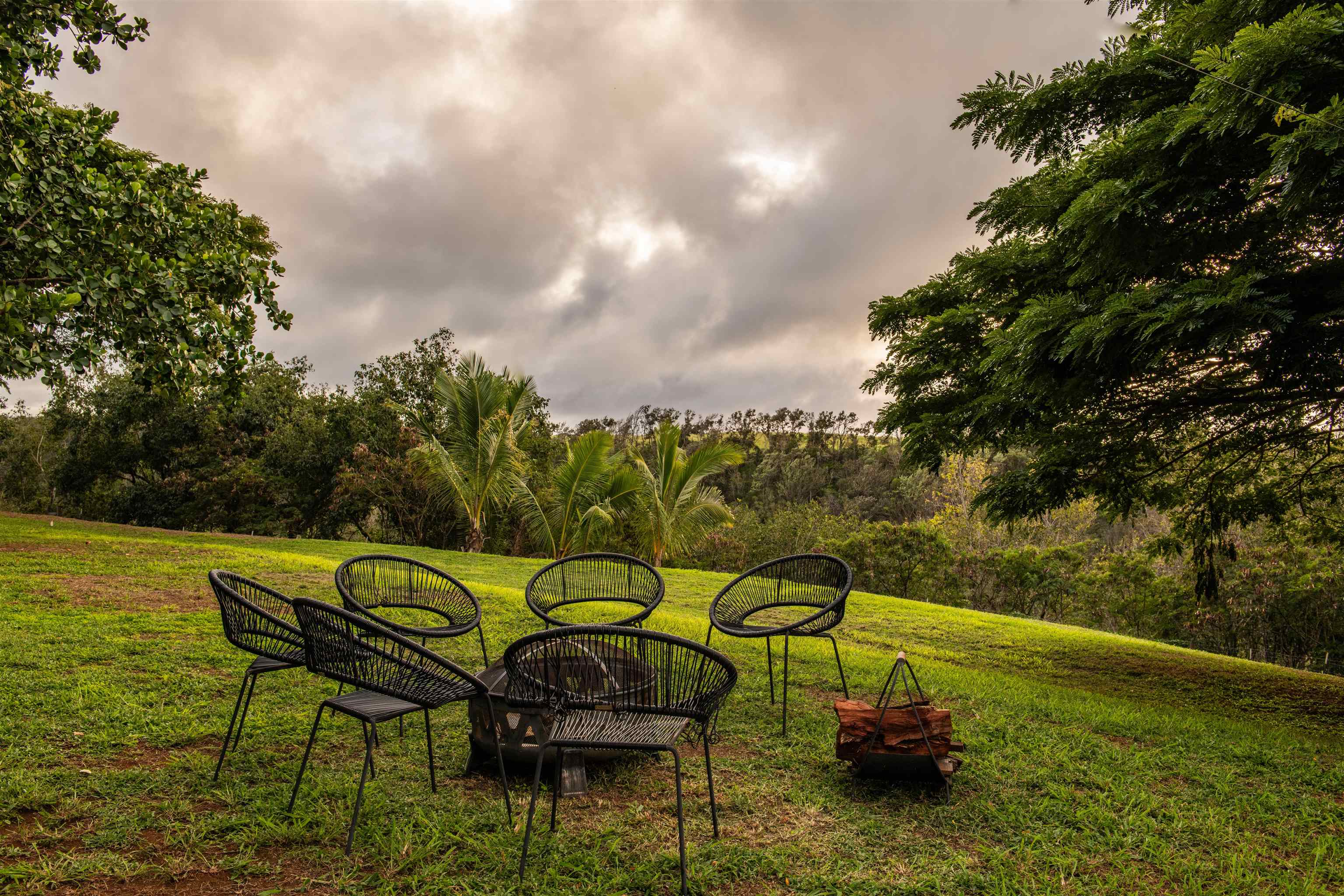 52 Papio Way, Unit A Haiku, HI 96708 - Photo 48 of 50 a view of a swimming pool with a lounge chair