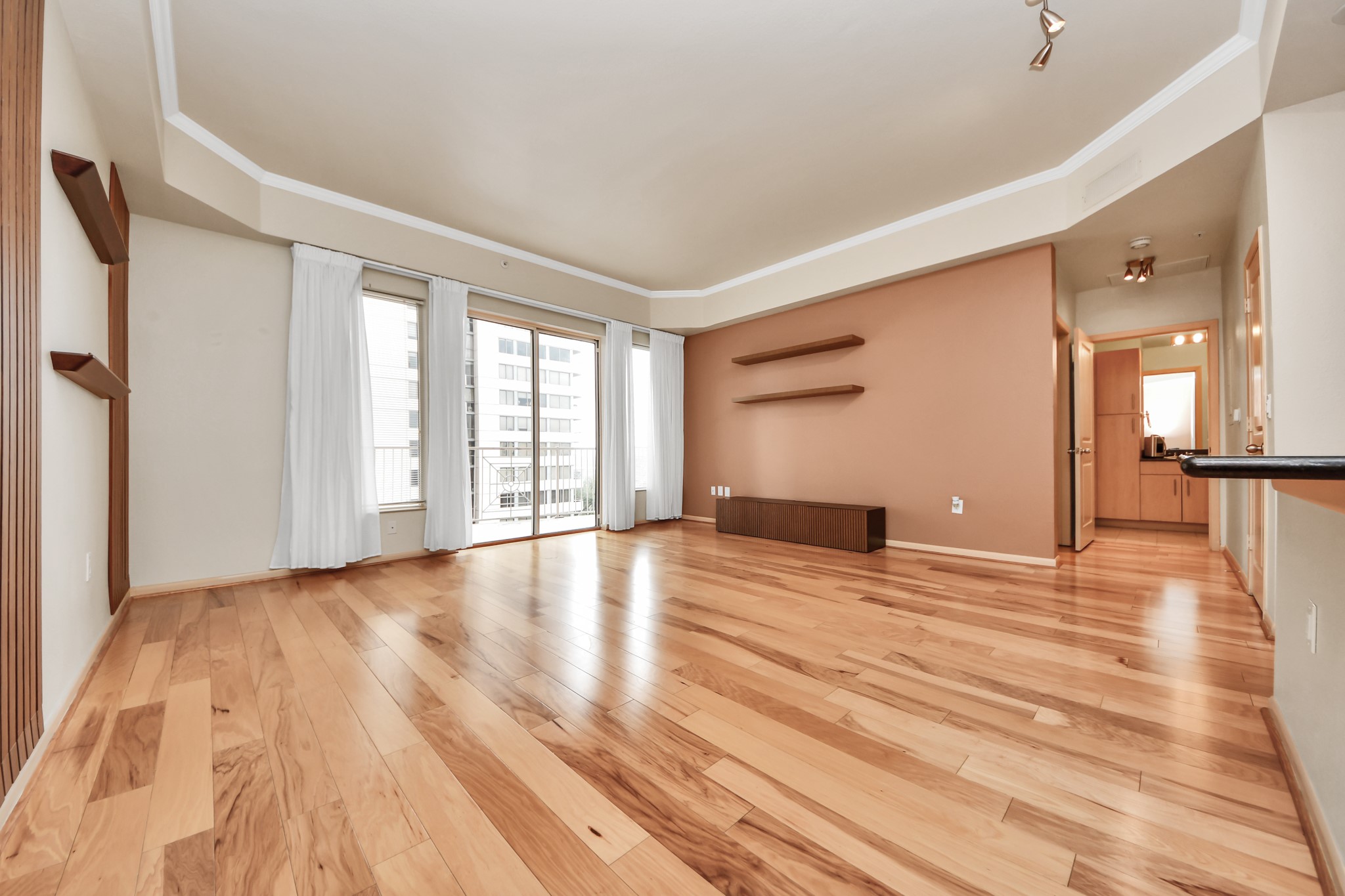 3505 Sage Road, Unit 604 Houston, TX 77056 - Photo 13 of 40 a view of an empty room with wooden floor and a window