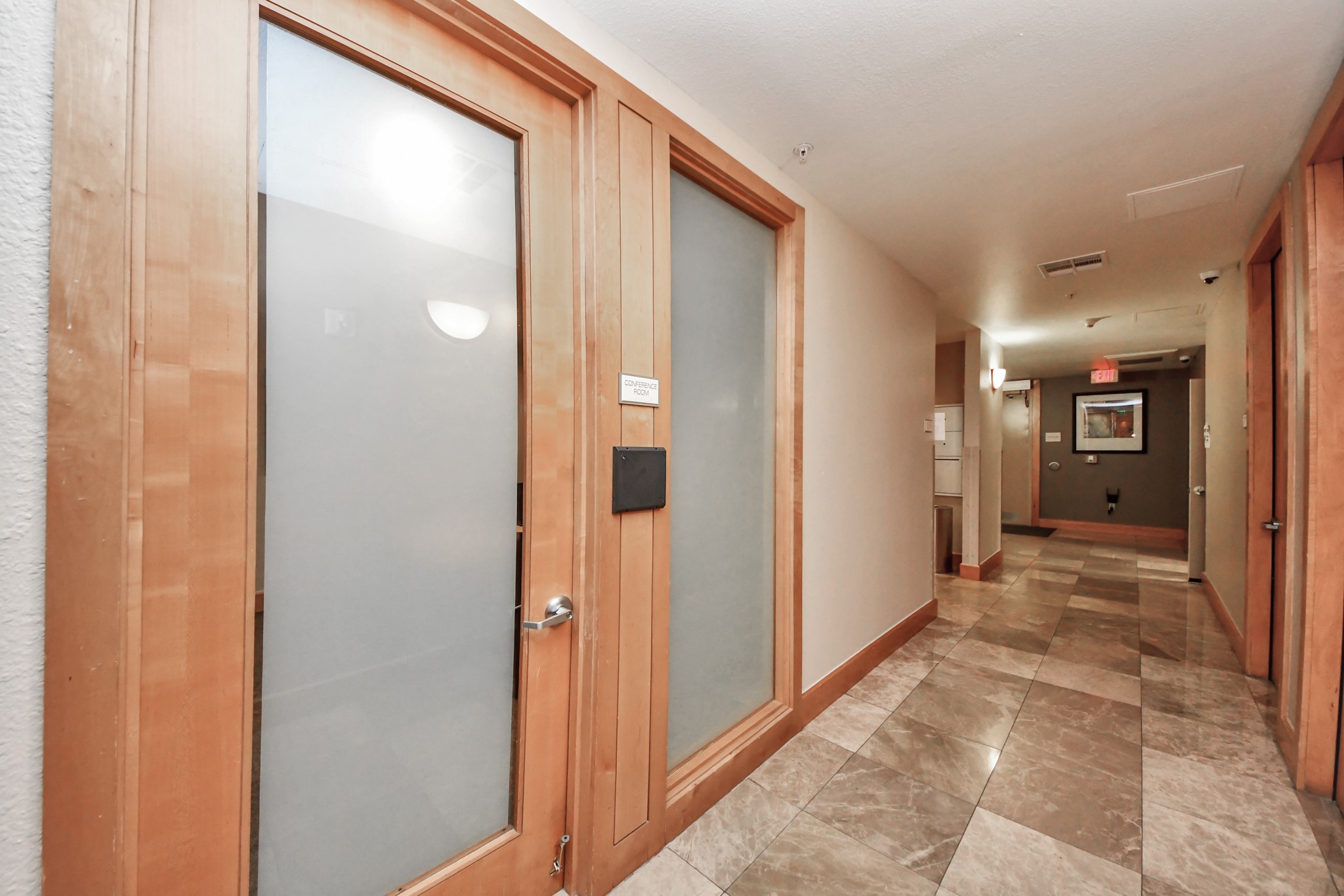3505 Sage Road, Unit 604 Houston, TX 77056 - Photo 30 of 40 a view of a hallway with wooden shelves