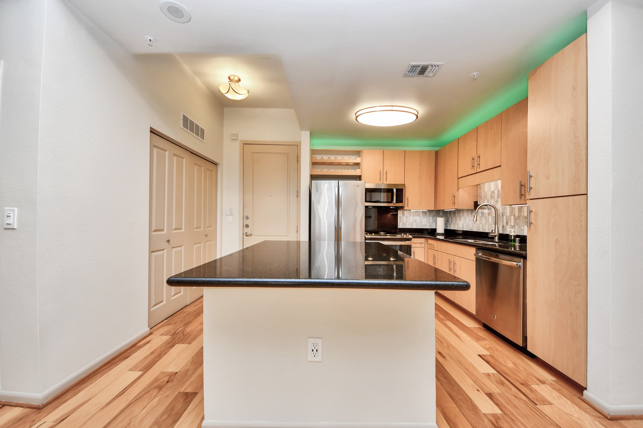 3505 Sage Road, Unit 604 Houston, TX 77056 - Photo 7 of 40 a kitchen with stainless steel appliances granite countertop a refrigerator a stove a sink and a refrigerator