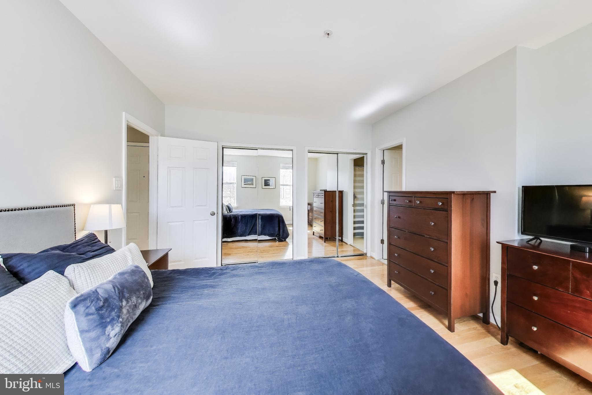 1619 R Street Northwest, Unit 501 Washington, DC 20009 - Photo 18 of 25 a living room with furniture and a flat screen tv