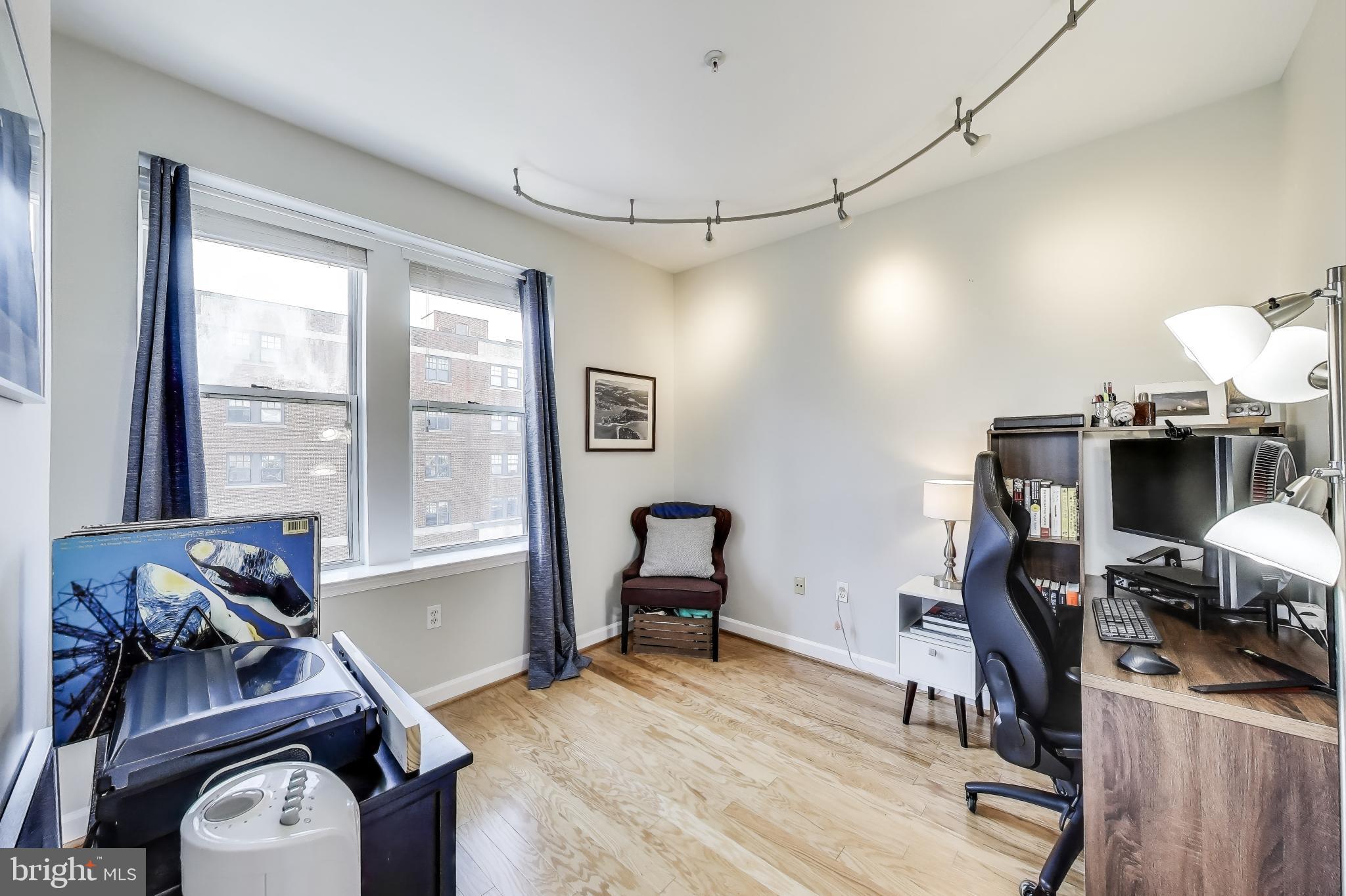 1619 R Street Northwest, Unit 501 Washington, DC 20009 - Photo 20 of 25 a room with furniture and a window