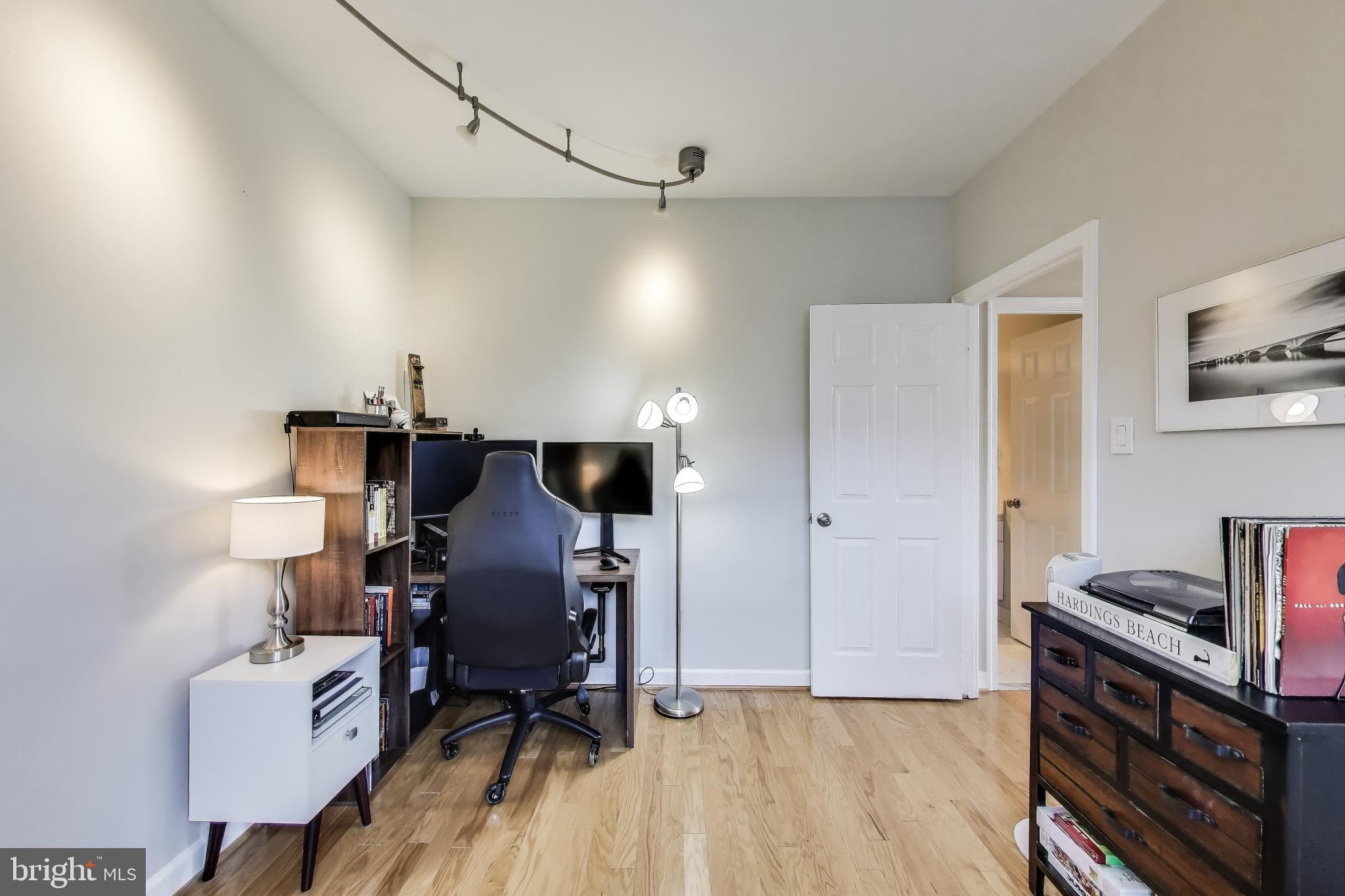 1619 R Street Northwest, Unit 501 Washington, DC 20009 - Photo 21 of 25 a view of a workspace with furniture and wooden floor
