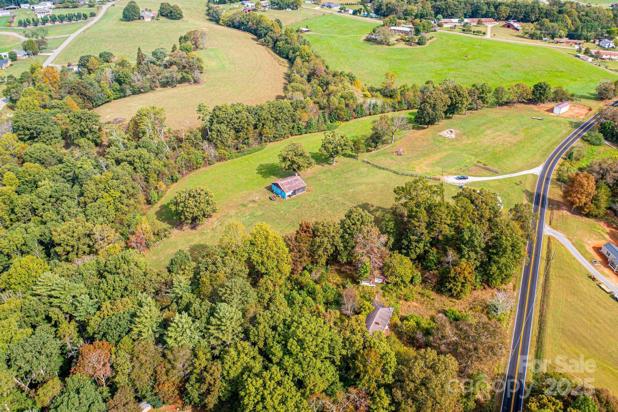 4744 Hickory Nut Ridge Road Hudson, NC 28638 - Photo 5 of 35 a view of a swimming pool with a yard