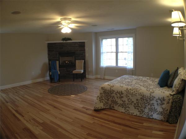 60 Tenney Road Westford, MA 01886 - Photo 15 of 27 a bedroom with a bed and a chandelier
