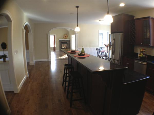 60 Tenney Road Westford, MA 01886 - Photo 7 of 27 a kitchen with sink refrigerator and cabinets
