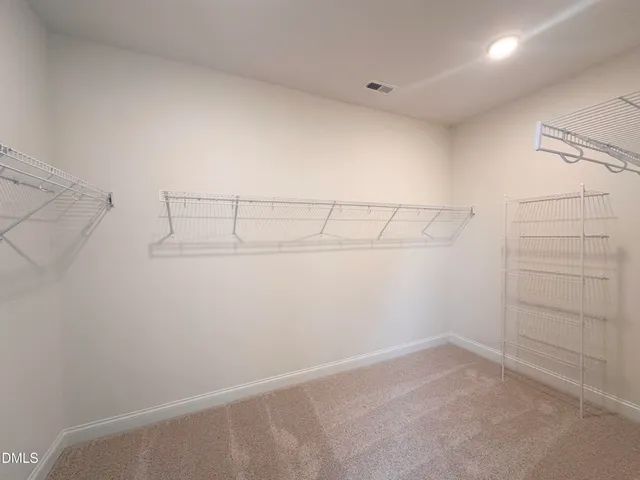 a view of a room with racks on the wall