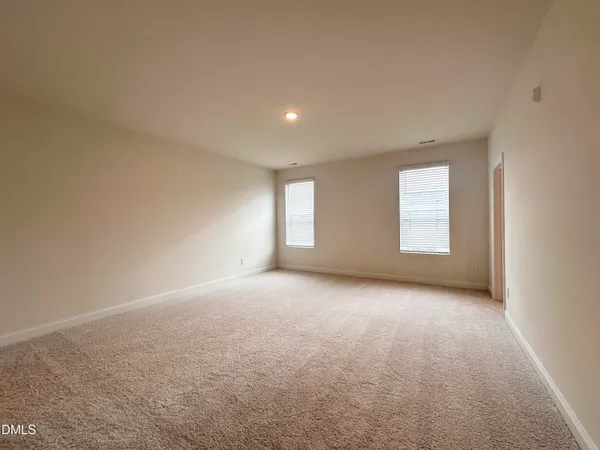 a view of empty room with windows