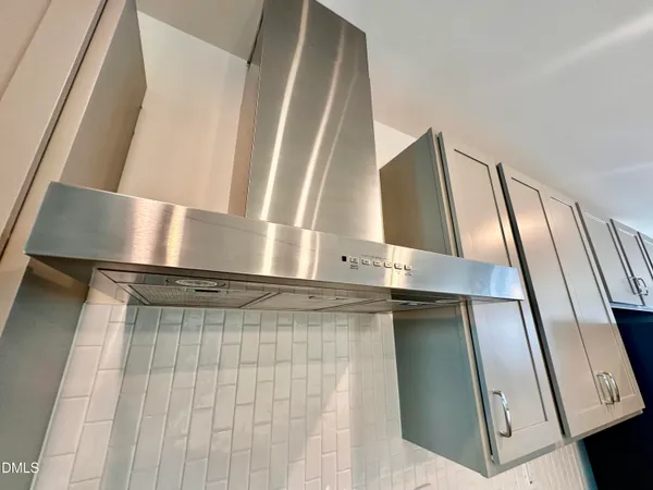 a bathroom with a sink a mirror and a shower