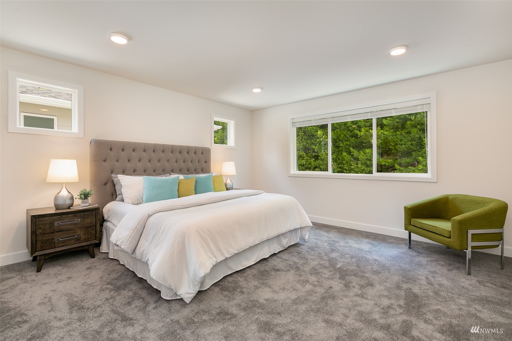 114 171st Place Southwest, Unit A Bothell, WA 98012 - Photo 13 of 26 a bedroom with a bed and a couch