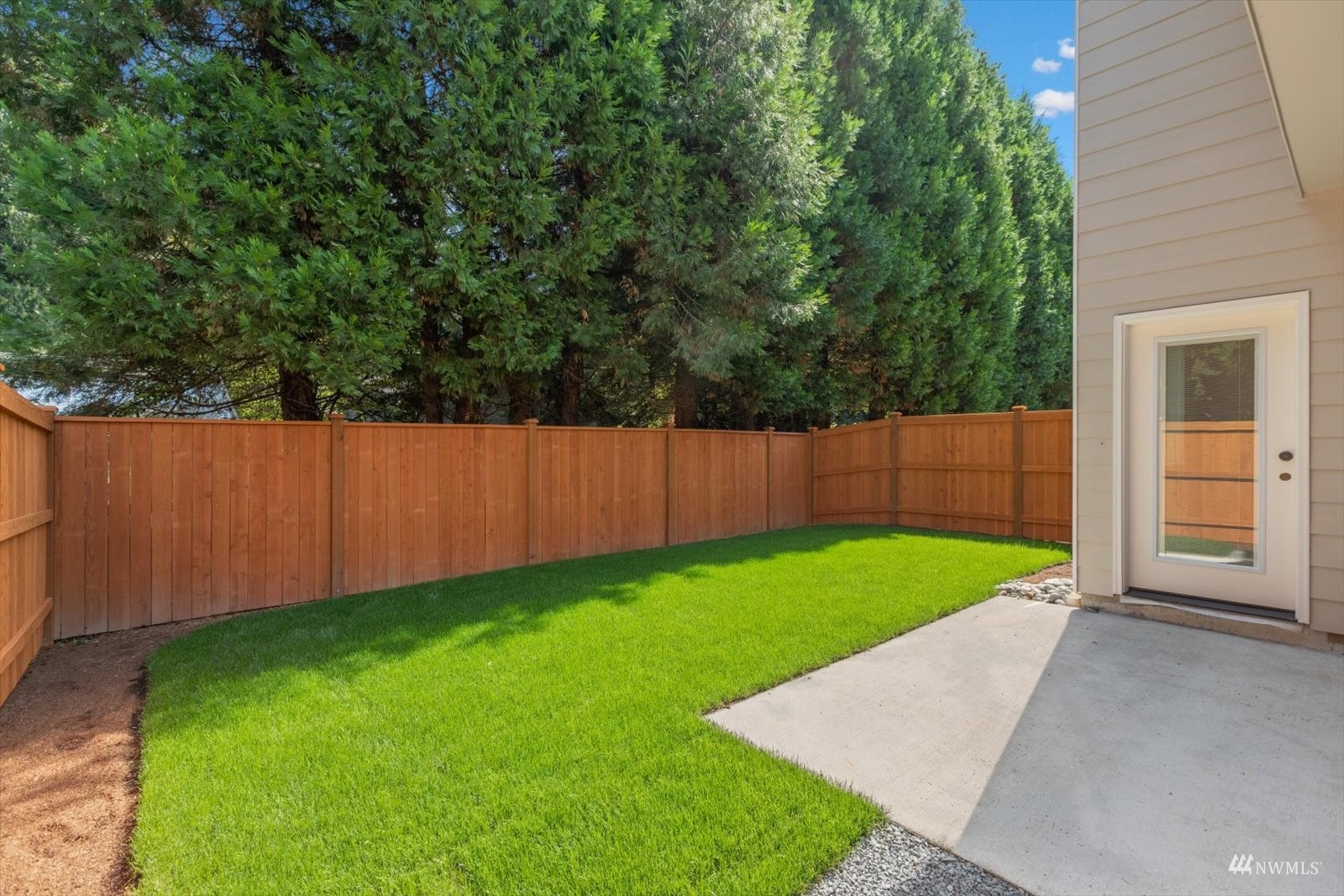 114 171st Place Southwest, Unit A Bothell, WA 98012 - Photo 21 of 26 a view of a backyard with wooden fence