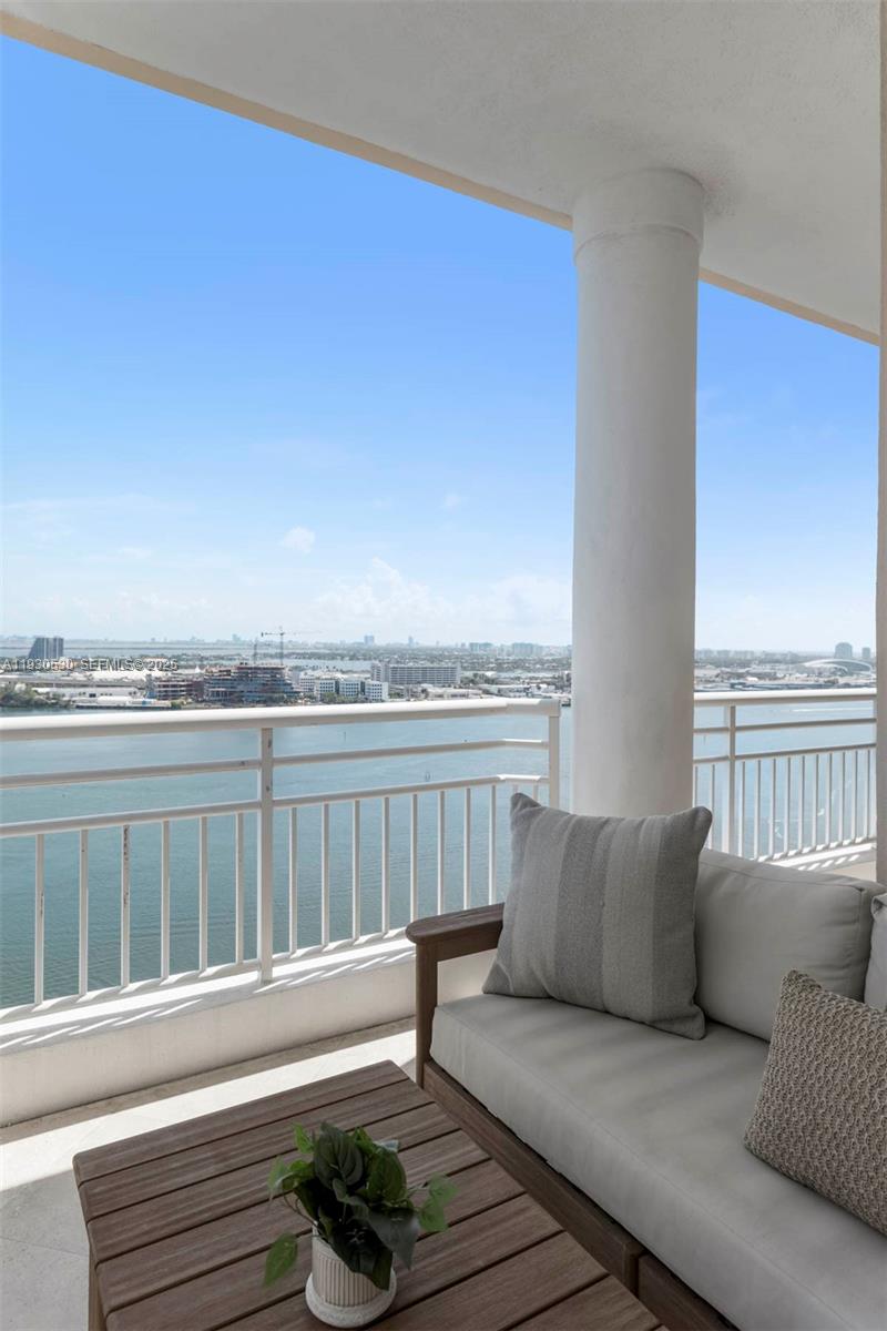 888 Brickell Key Drive, Unit 2606 Miami, FL 33131 - Photo 20 of 32 a living room with furniture and a floor to ceiling window