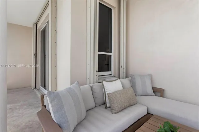 a living room with furniture and a window