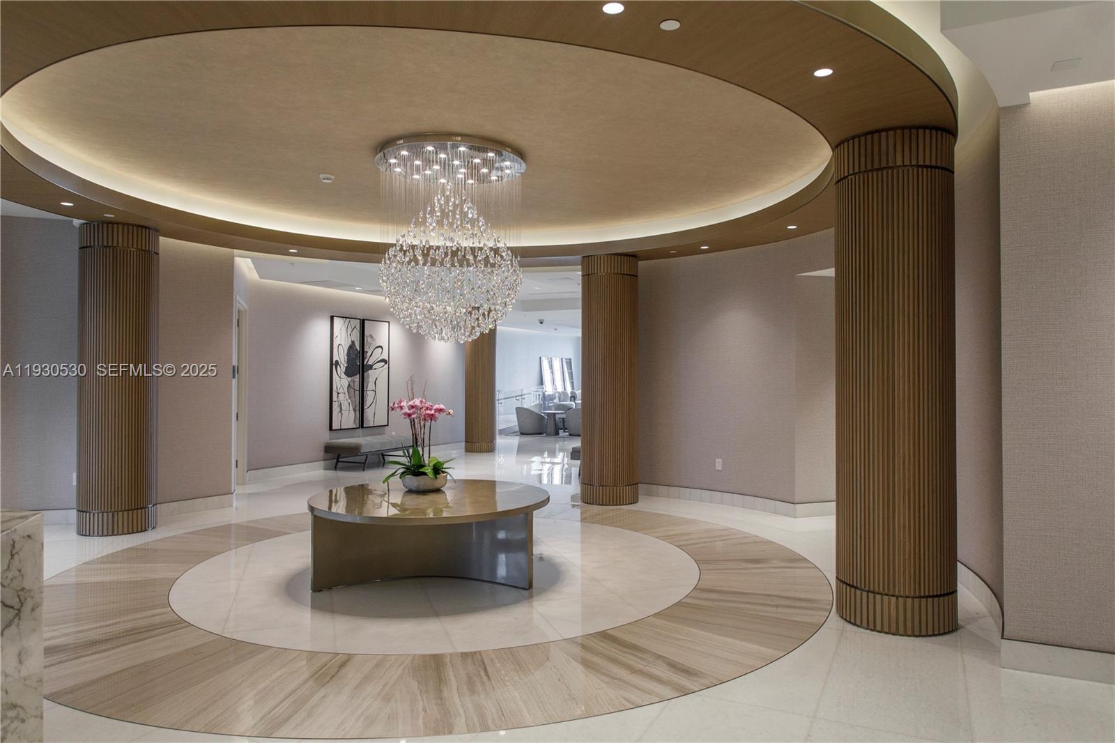 888 Brickell Key Drive, Unit 2606 Miami, FL 33131 - Photo 29 of 32 a lobby with furniture and a chandelier
