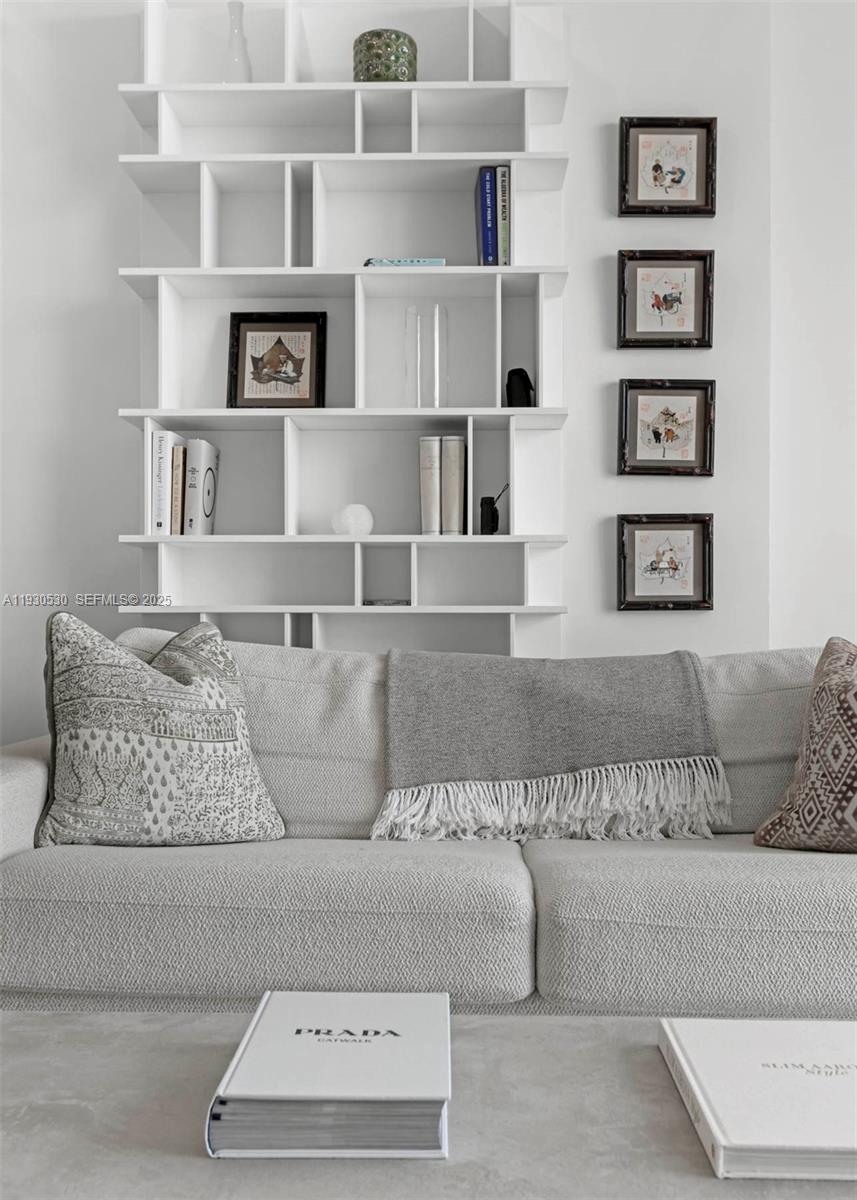 888 Brickell Key Drive, Unit 2606 Miami, FL 33131 - Photo 4 of 32 a living room with furniture and a couch
