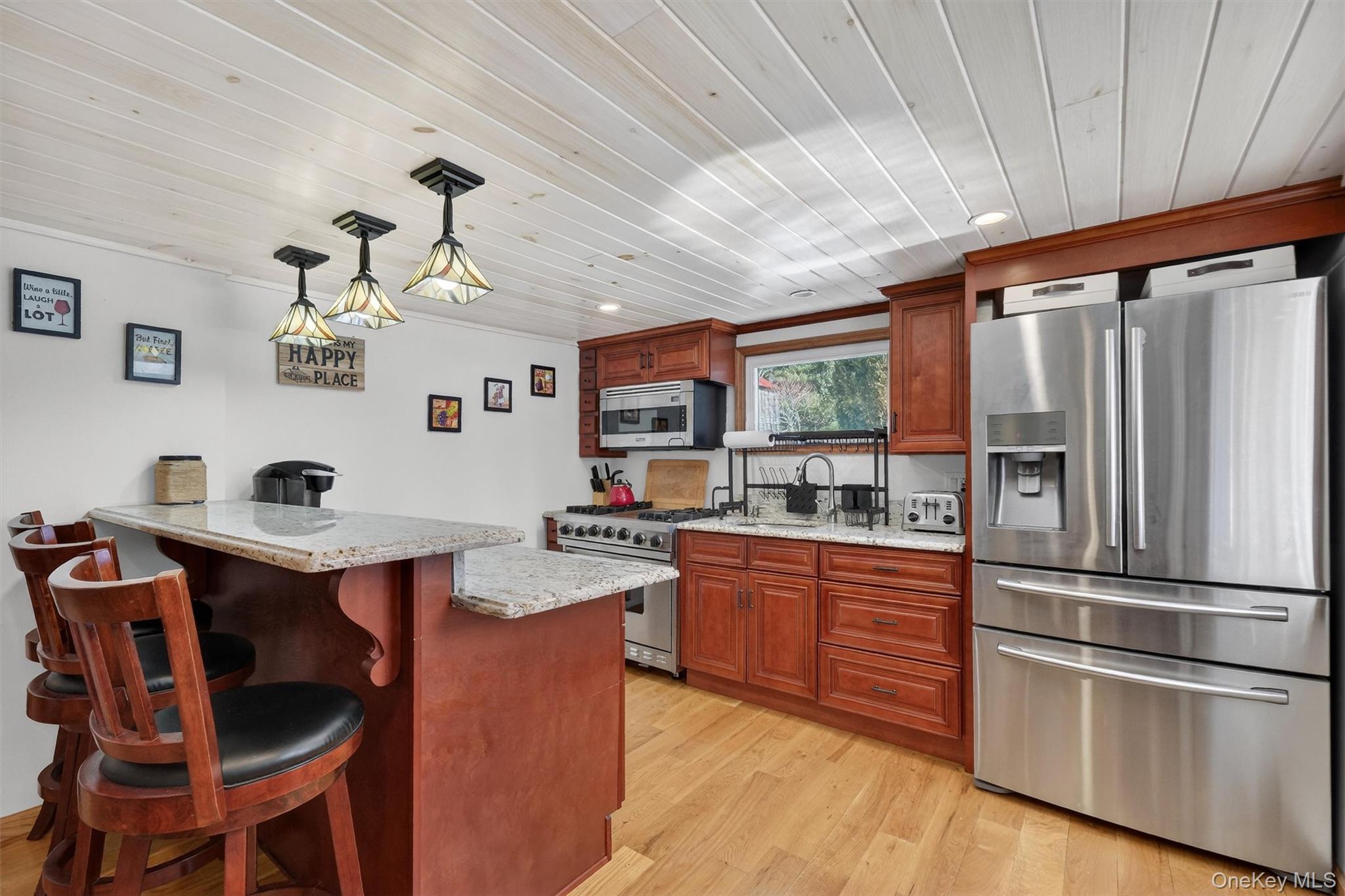 50 Tempaloni Road Ellenville, NY 12428 - Photo 12 of 46 a kitchen with stainless steel appliances granite countertop a sink stove and refrigerator