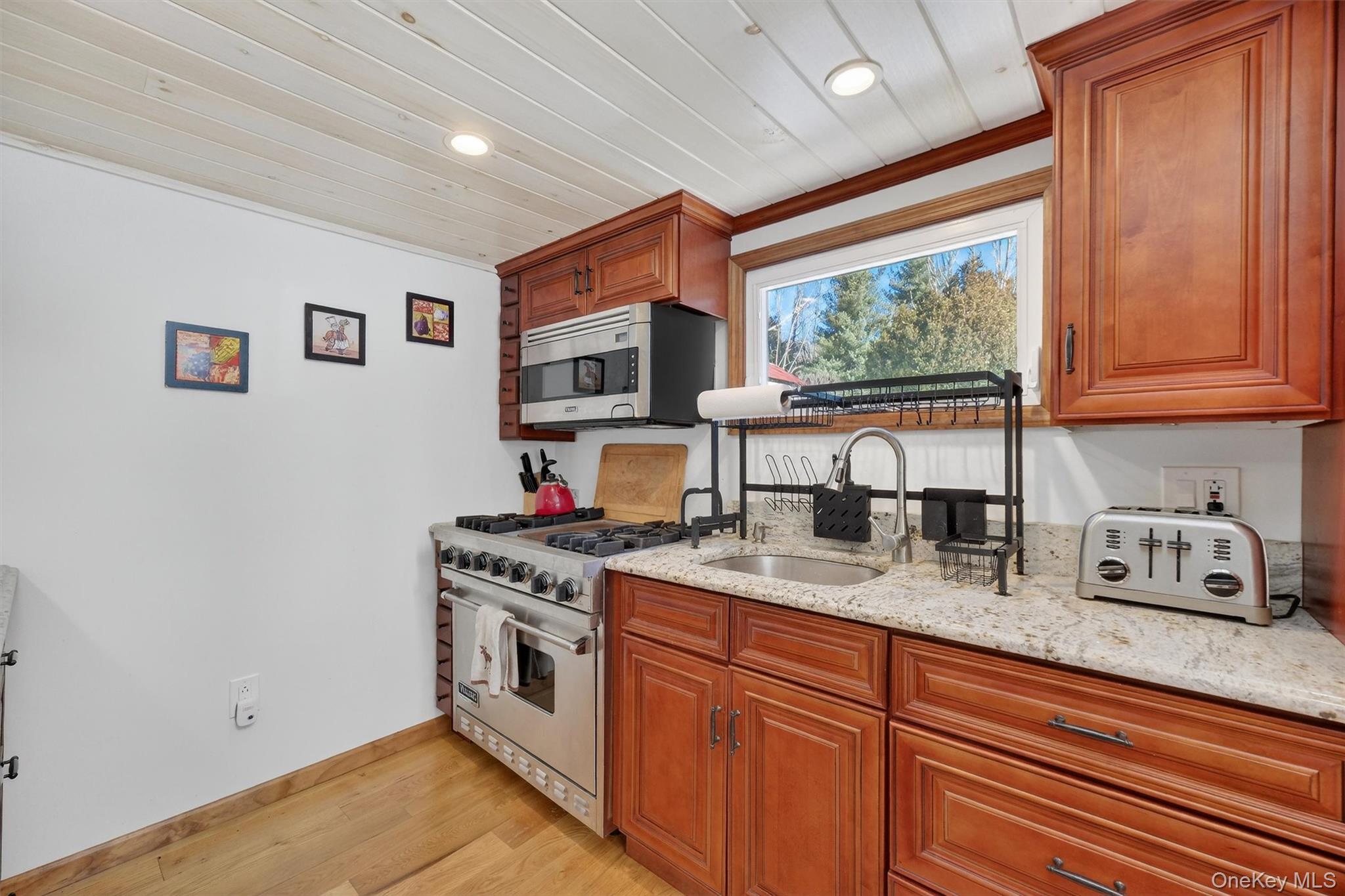 50 Tempaloni Road Ellenville, NY 12428 - Photo 14 of 46 a kitchen with stainless steel appliances granite countertop a stove and a sink