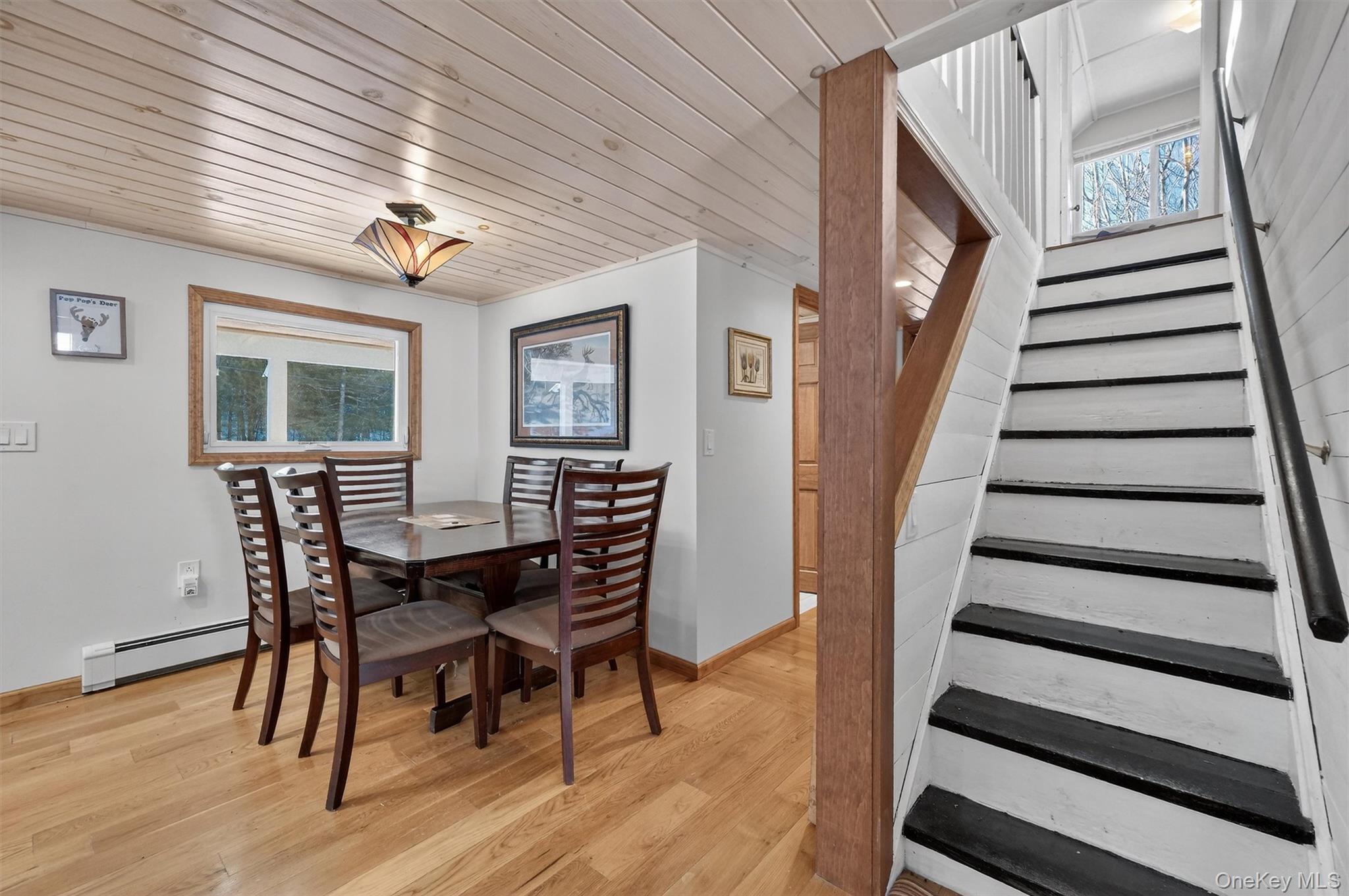 50 Tempaloni Road Ellenville, NY 12428 - Photo 16 of 46 a view of a dining room with furniture and wooden floor