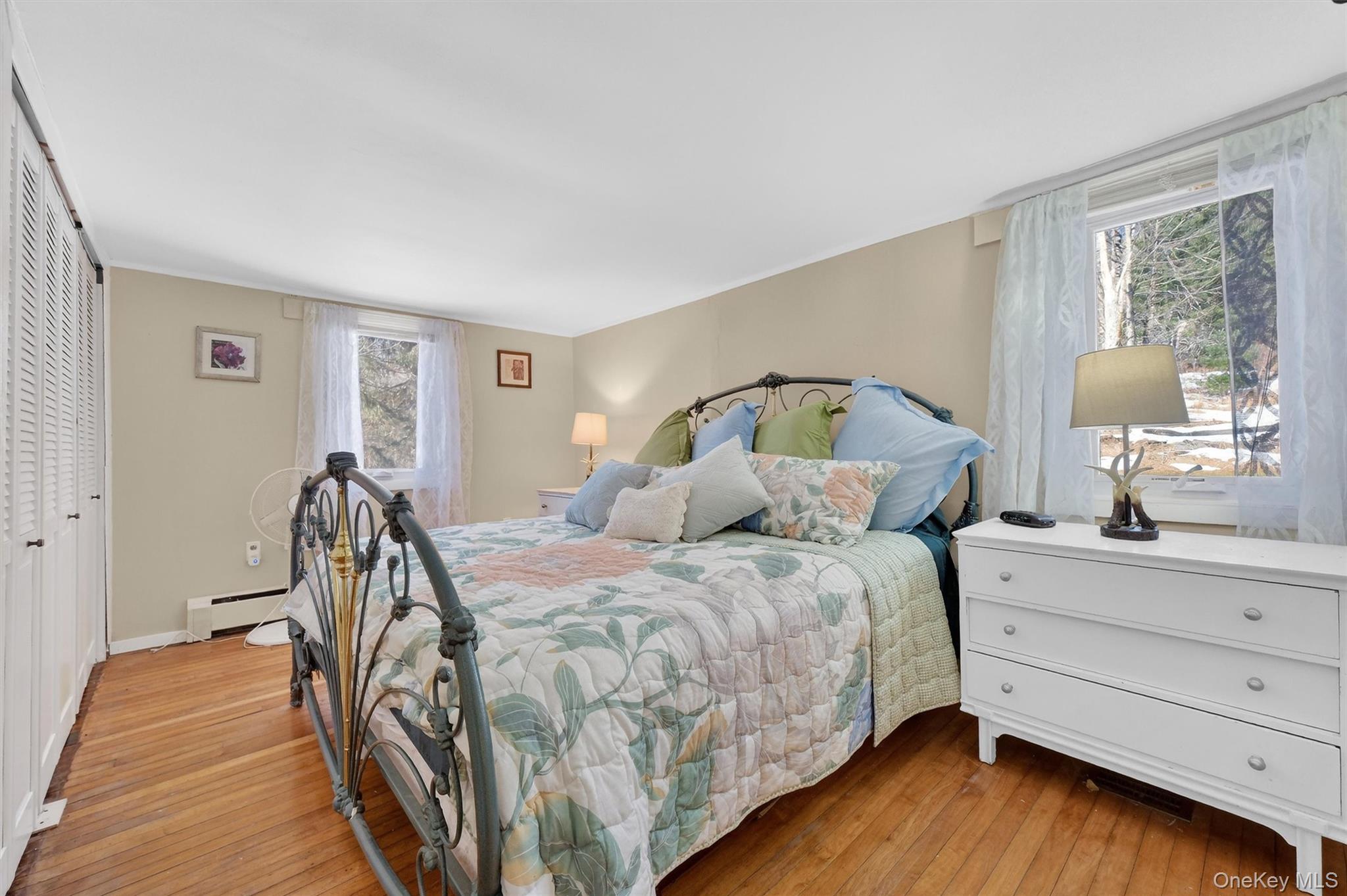 50 Tempaloni Road Ellenville, NY 12428 - Photo 22 of 46 a bed room with a bed and a dresser