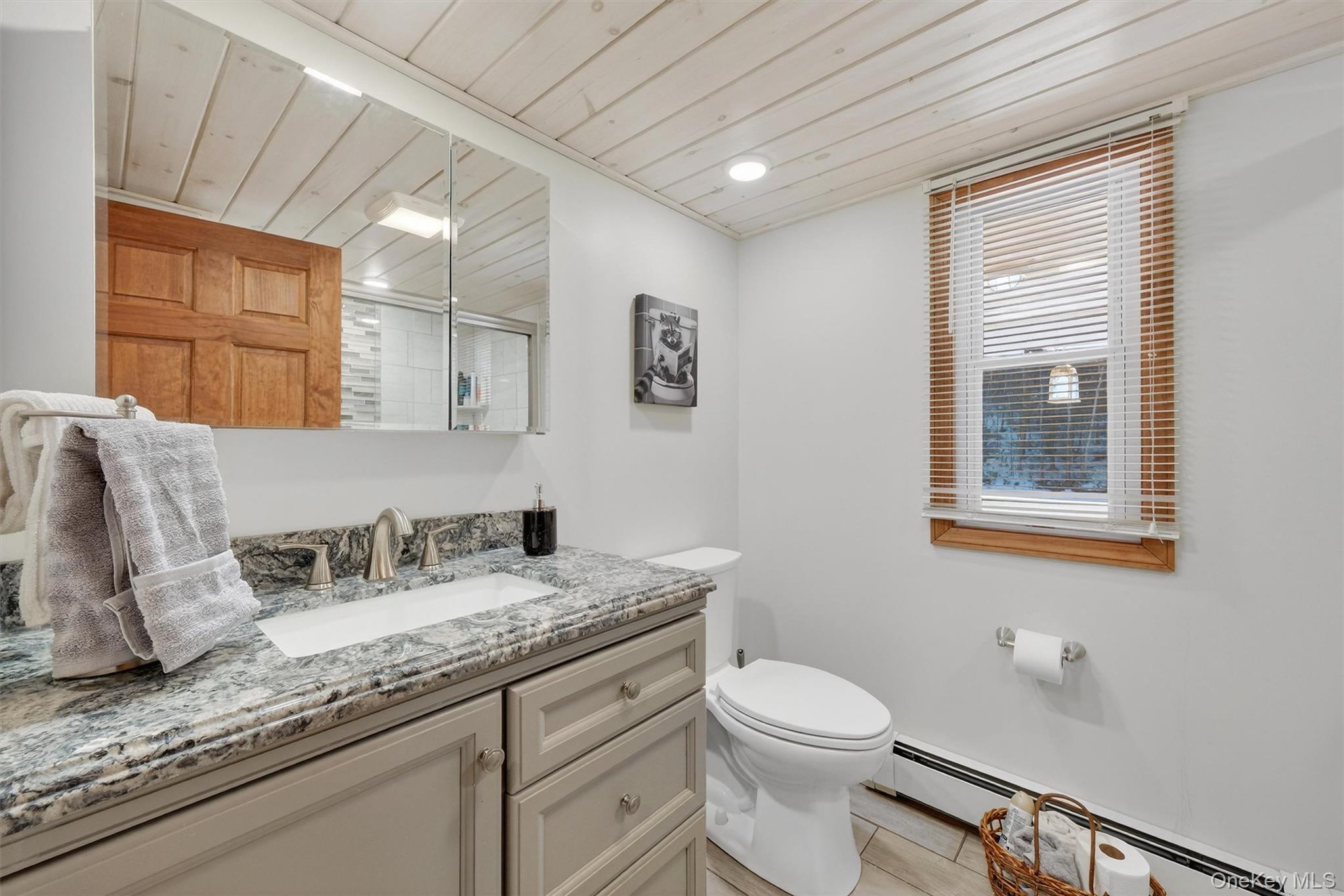 50 Tempaloni Road Ellenville, NY 12428 - Photo 24 of 46 a bathroom with a granite countertop sink mirror vanity and toilet