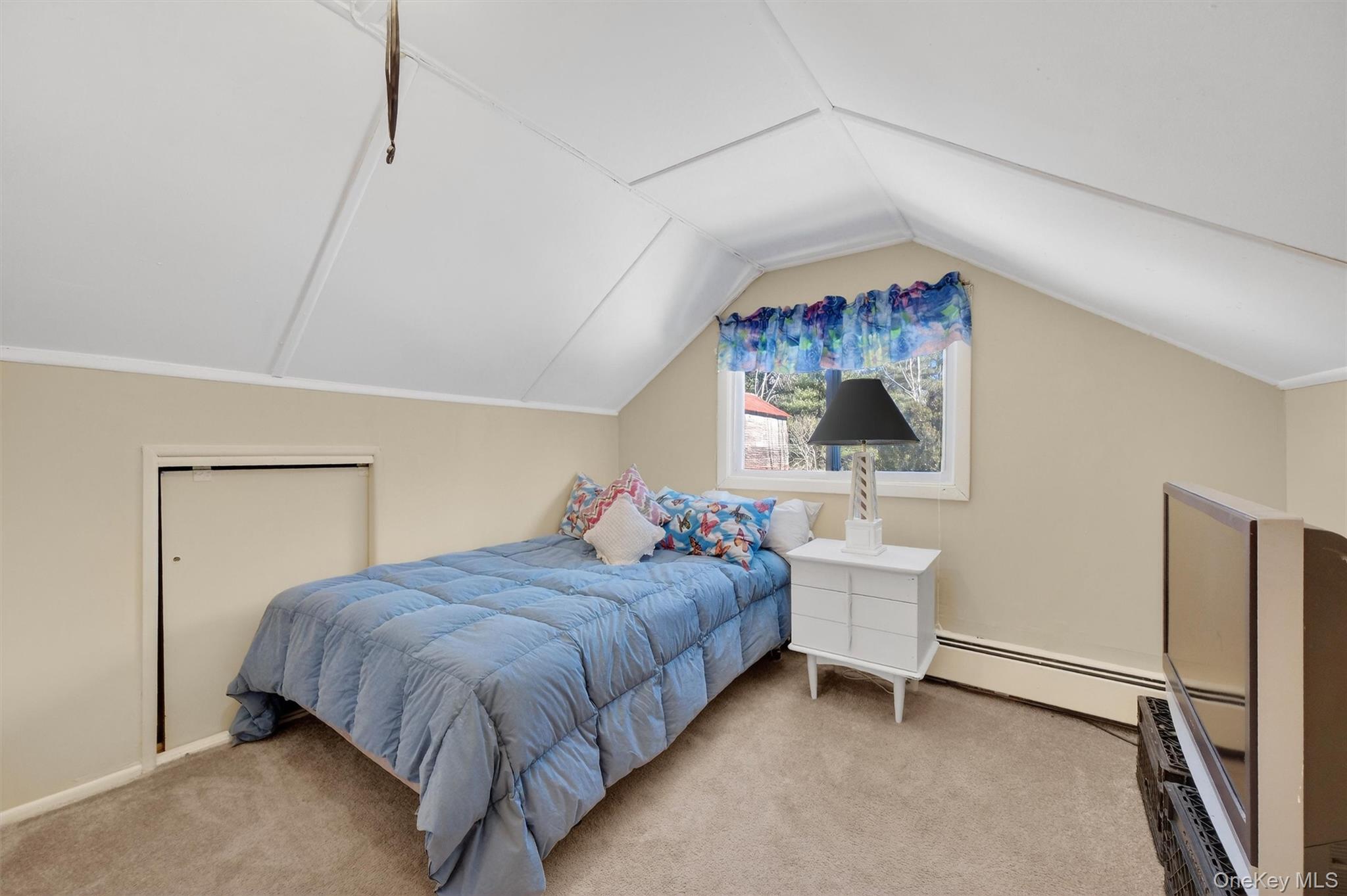 50 Tempaloni Road Ellenville, NY 12428 - Photo 27 of 46 a bedroom with a bed and a table