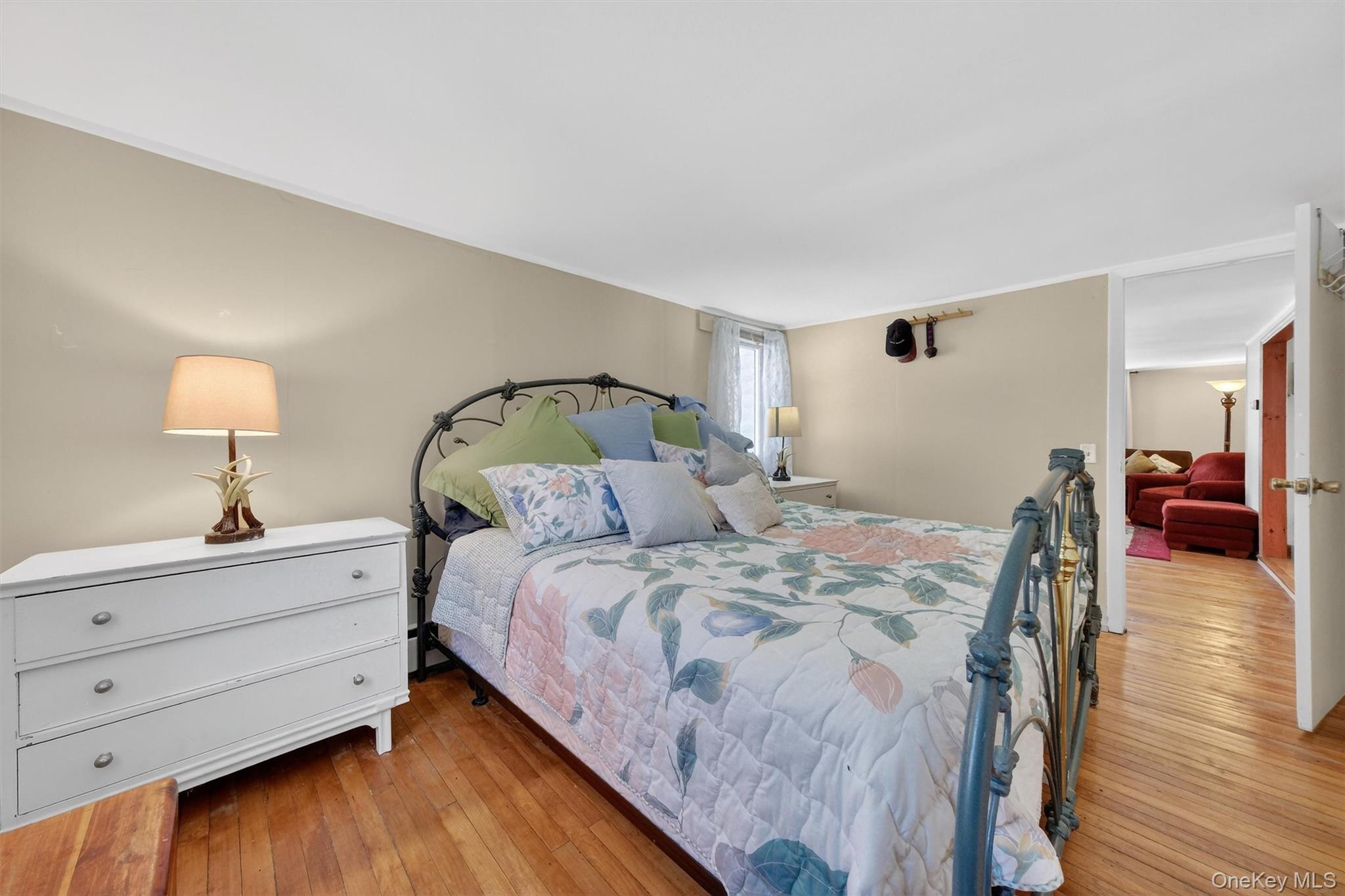 50 Tempaloni Road Ellenville, NY 12428 - Photo 43 of 46 a bedroom with a bed and a mirror