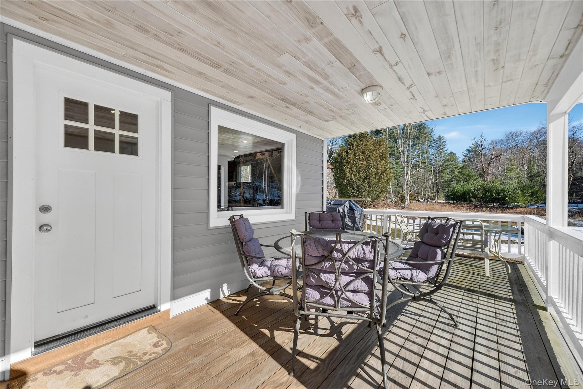 50 Tempaloni Road Ellenville, NY 12428 - Photo 9 of 46 a view of a patio with table and chairs
