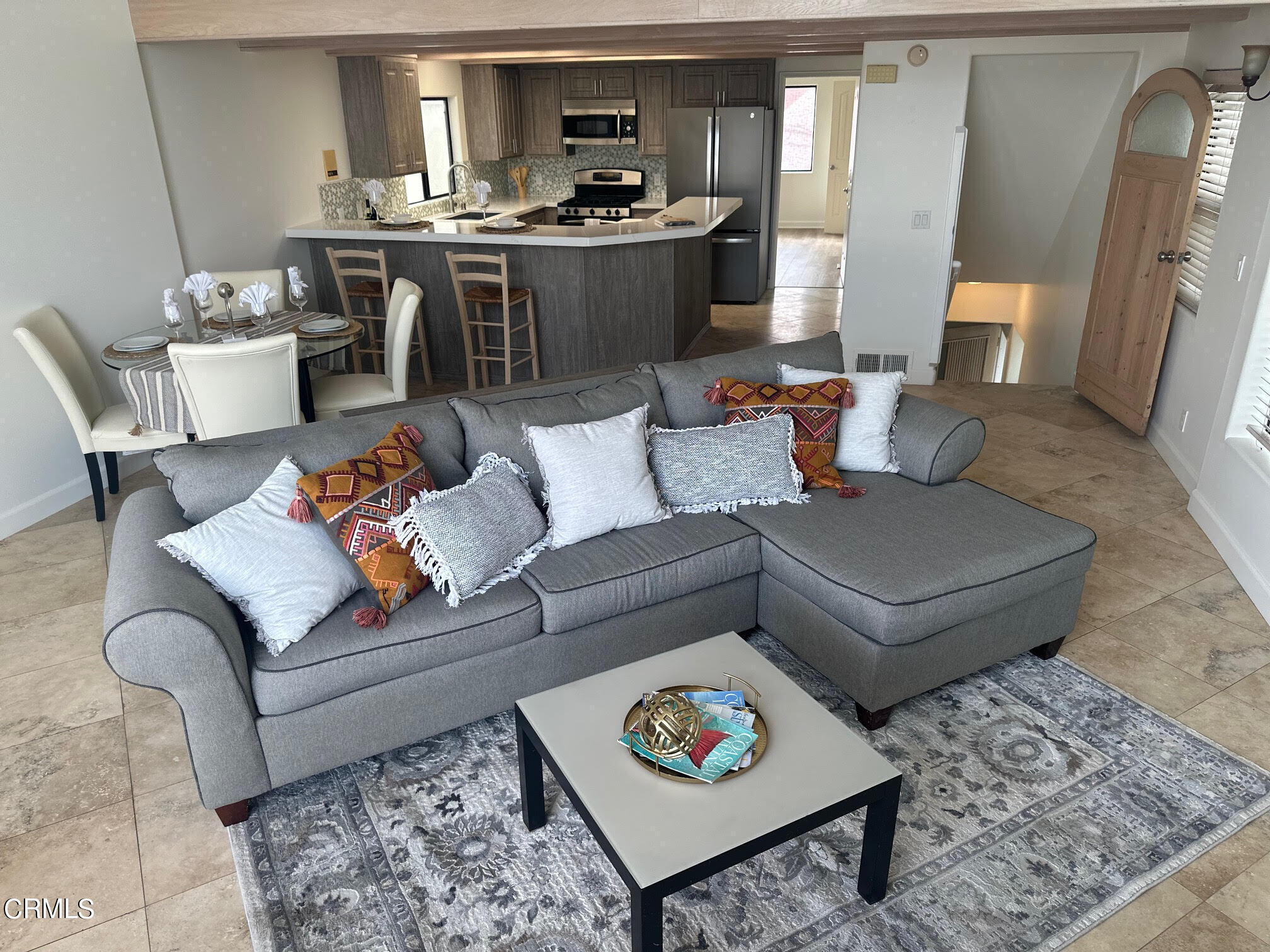 312 Melrose Drive Oxnard, CA 93035 - Photo 12 of 58 a living room with furniture and a rug