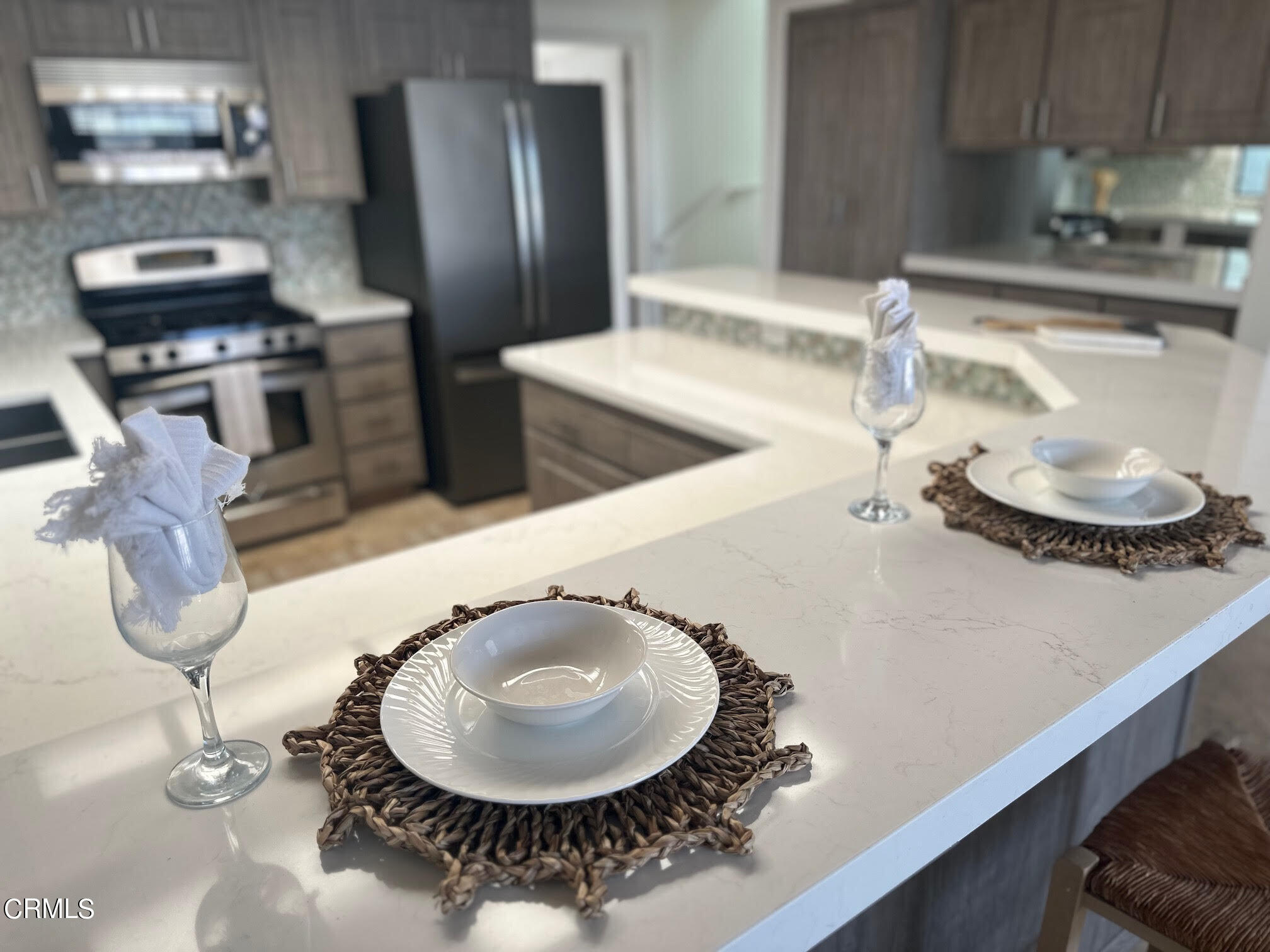 312 Melrose Drive Oxnard, CA 93035 - Photo 16 of 58 a kitchen with a table and chairs