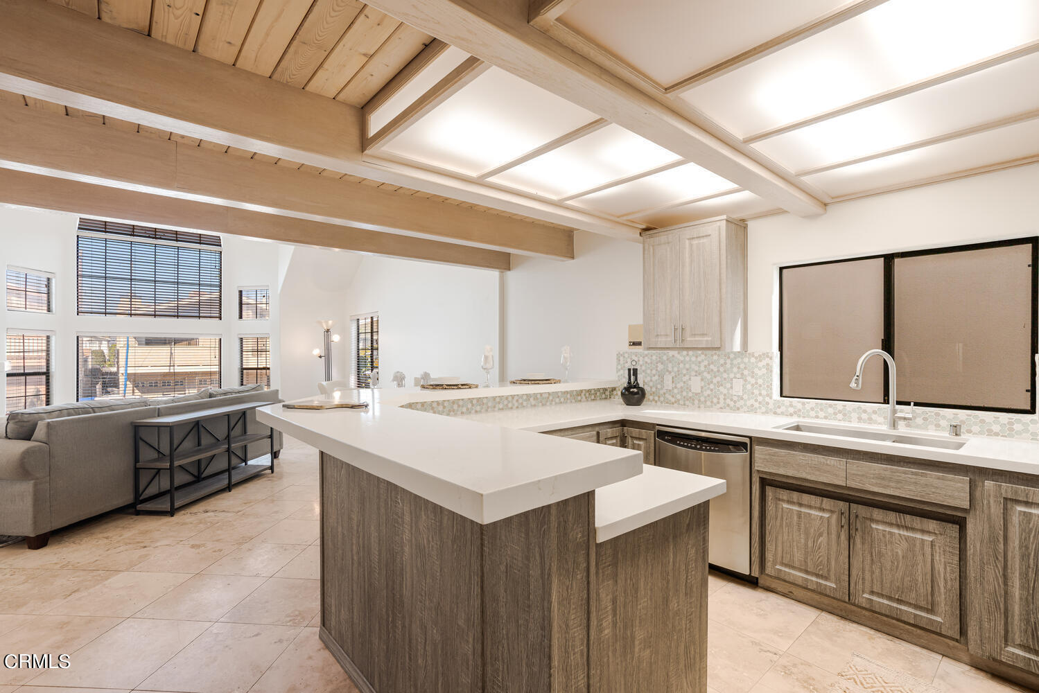 312 Melrose Drive Oxnard, CA 93035 - Photo 18 of 58 a kitchen with a sink stove and cabinets