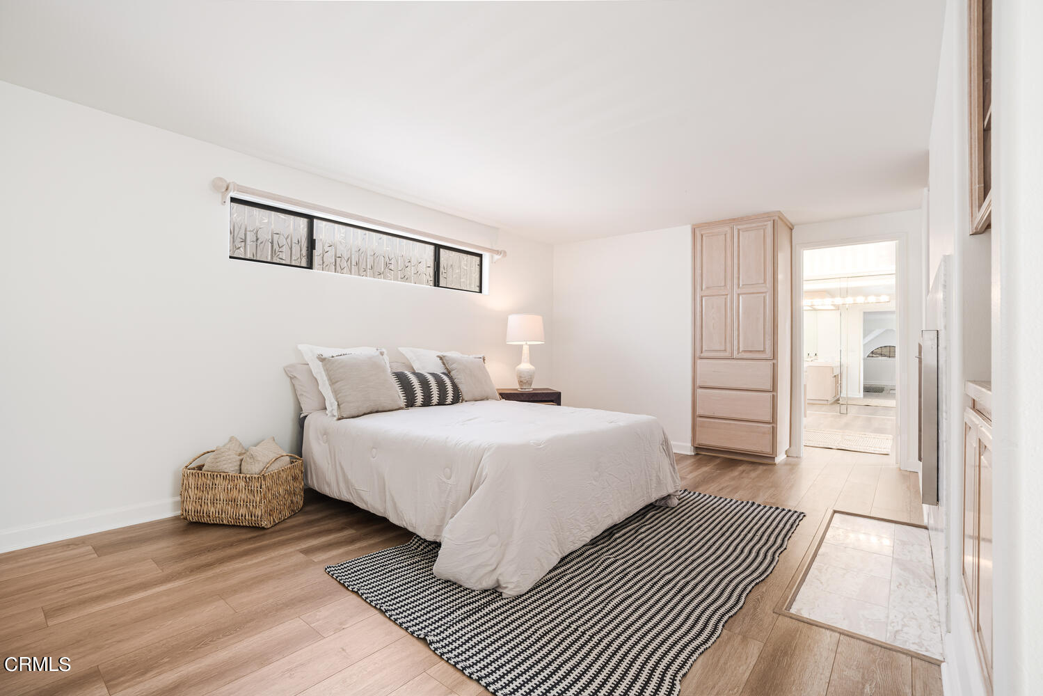 312 Melrose Drive Oxnard, CA 93035 - Photo 23 of 58 a spacious bedroom with a bed and a walk in closet