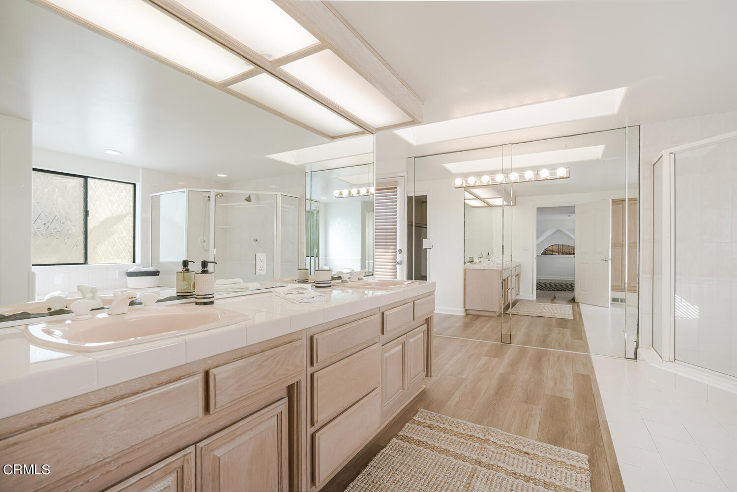 312 Melrose Drive Oxnard, CA 93035 - Photo 25 of 58 a spacious bathroom with a double vanity sink and mirror