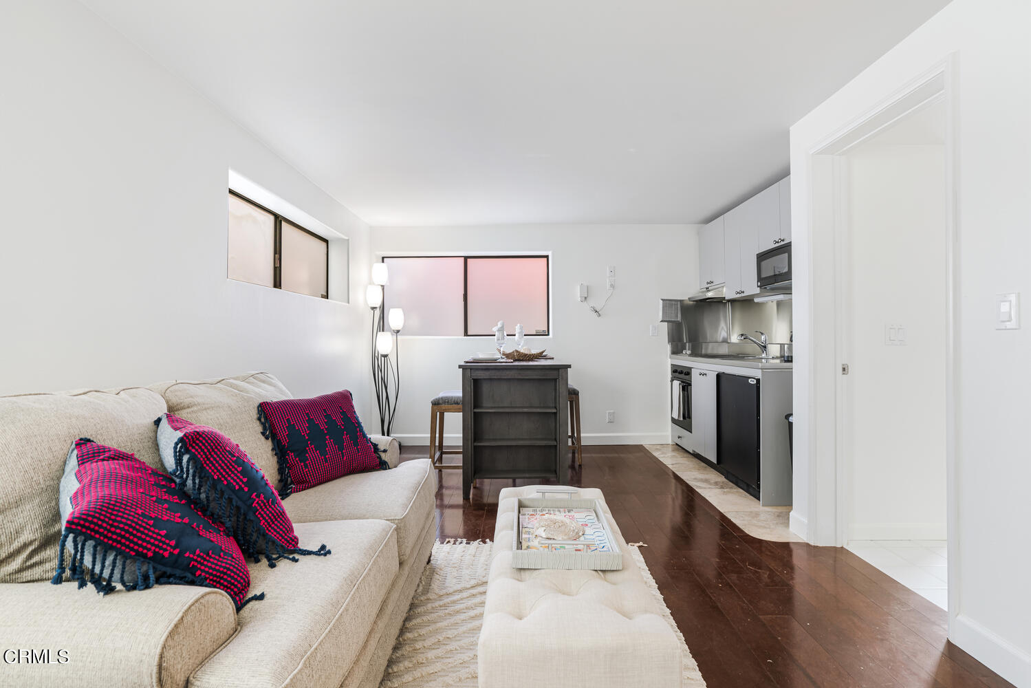 312 Melrose Drive Oxnard, CA 93035 - Photo 32 of 58 a living room with furniture and a kitchen