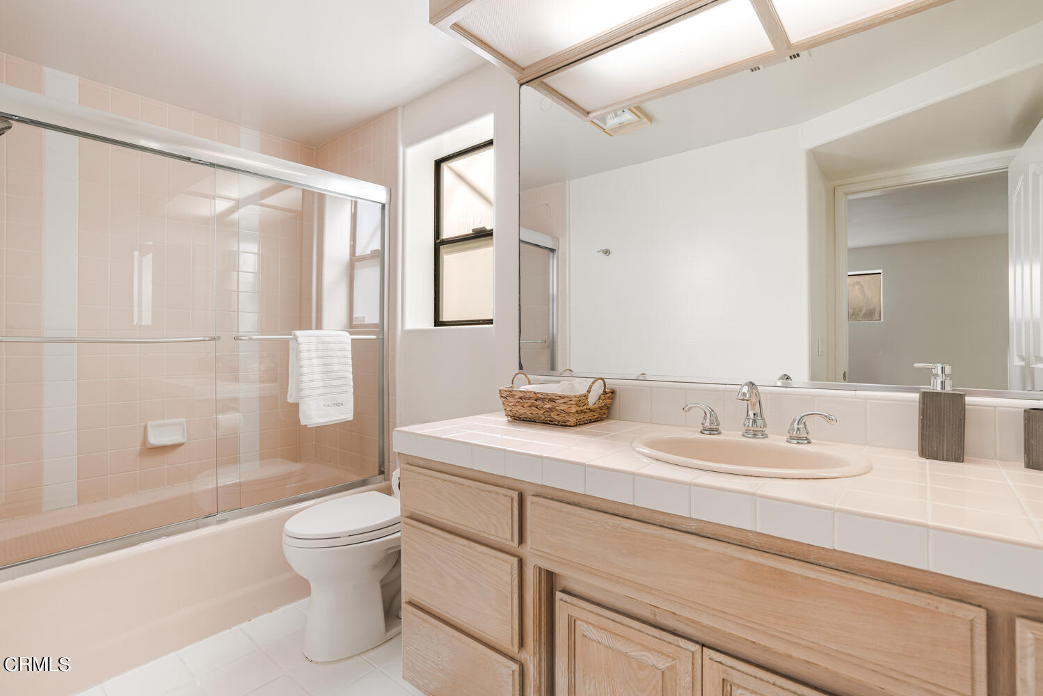 312 Melrose Drive Oxnard, CA 93035 - Photo 38 of 58 a bathroom with a granite countertop sink a toilet and shower