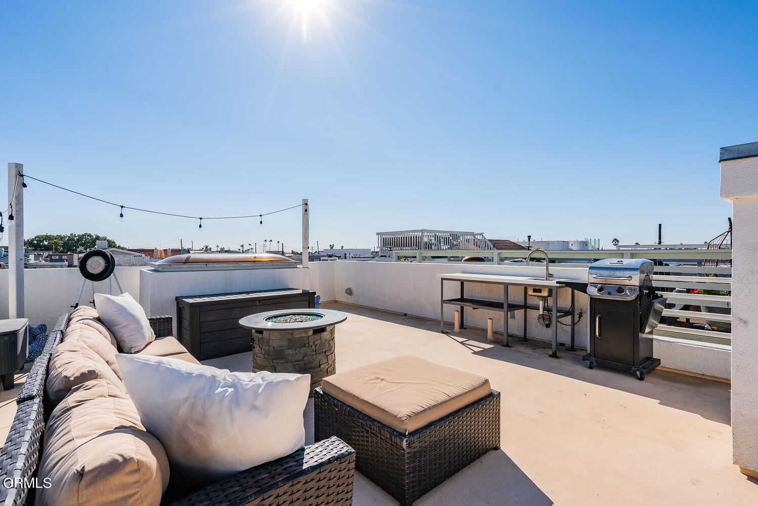 312 Melrose Drive Oxnard, CA 93035 - Photo 41 of 58 a living room with furniture a flat screen tv and kitchen view