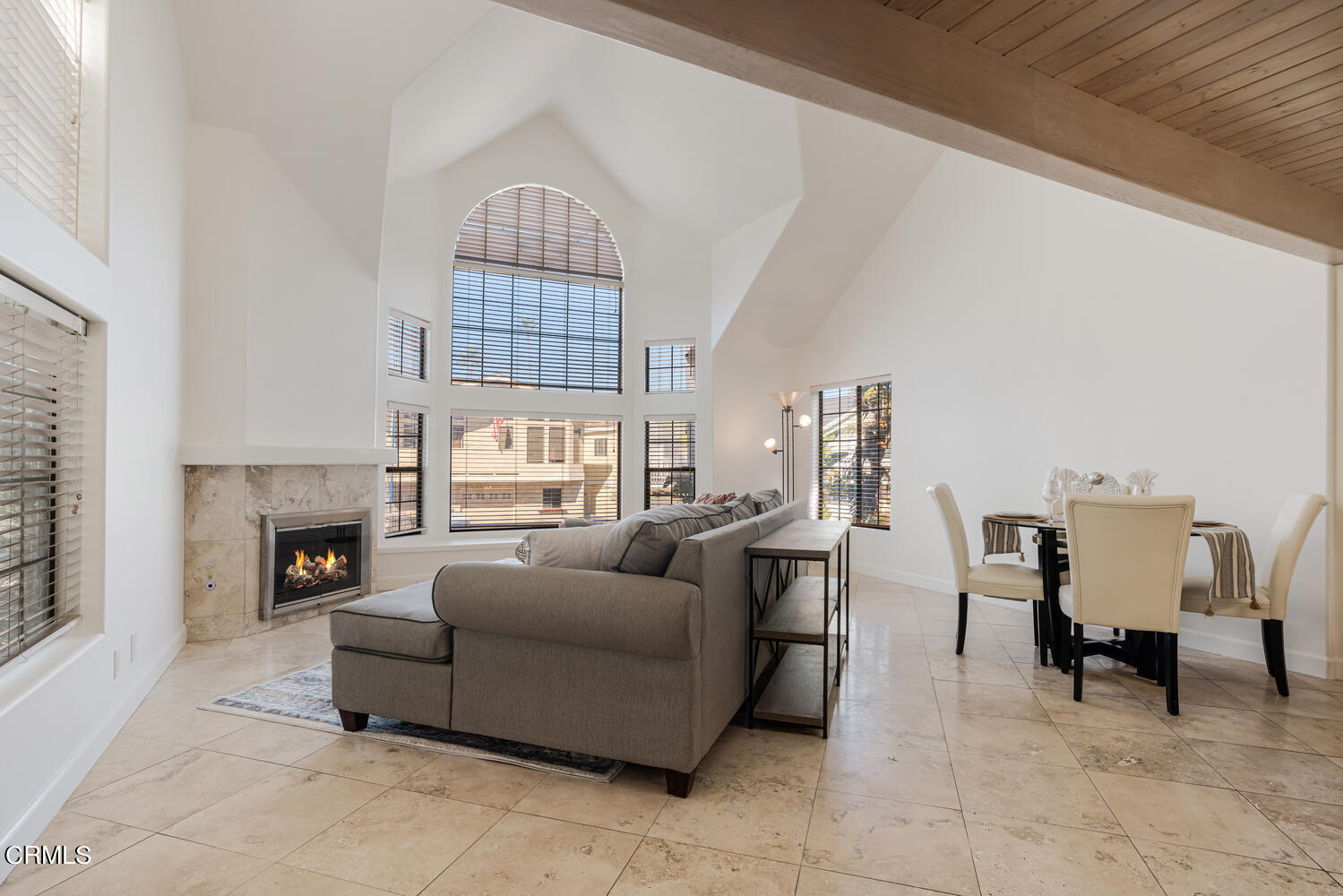 312 Melrose Drive Oxnard, CA 93035 - Photo 7 of 58 a living room with furniture a fireplace and a large window