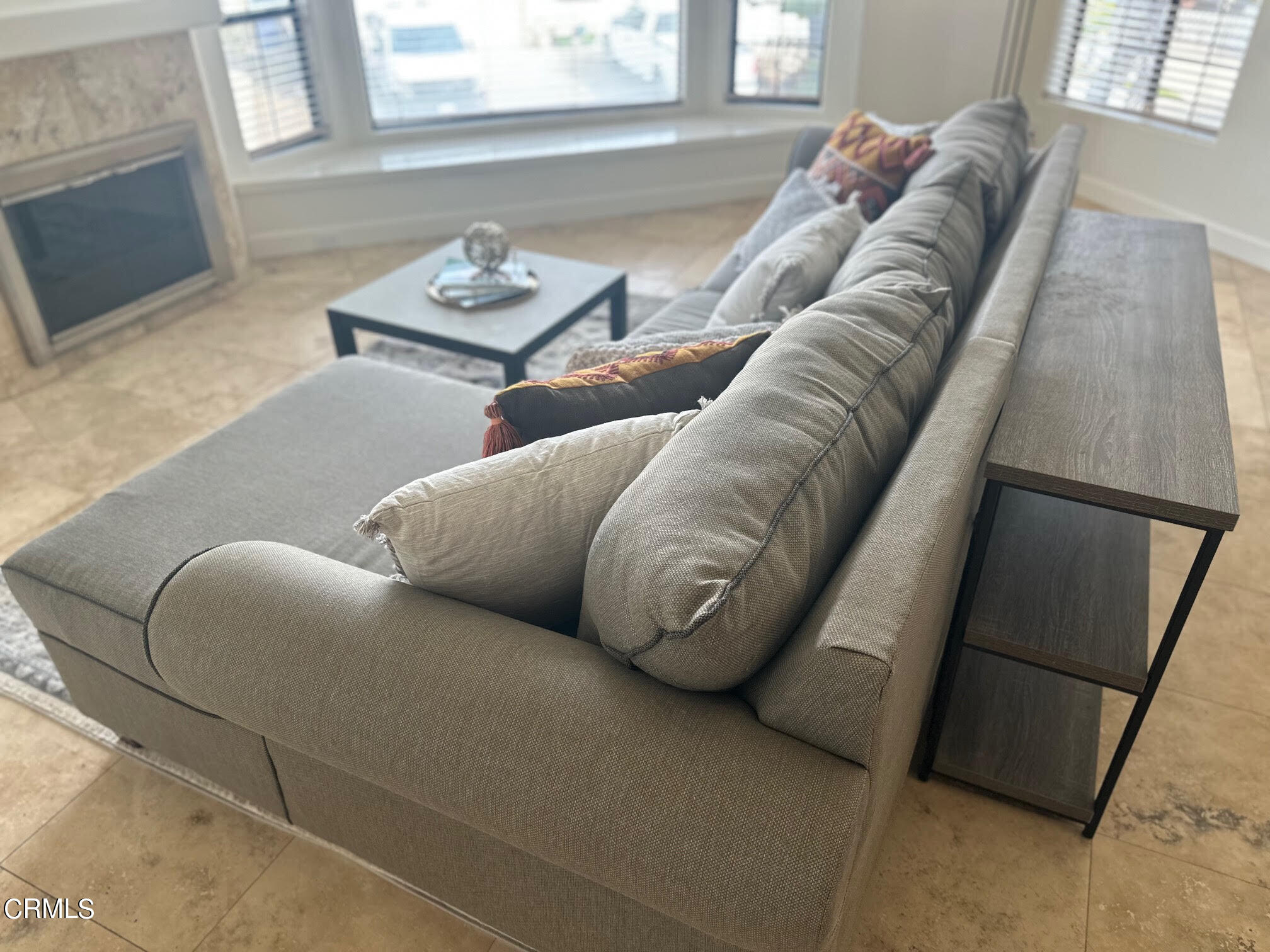 312 Melrose Drive Oxnard, CA 93035 - Photo 10 of 58 a living room with furniture and a fireplace