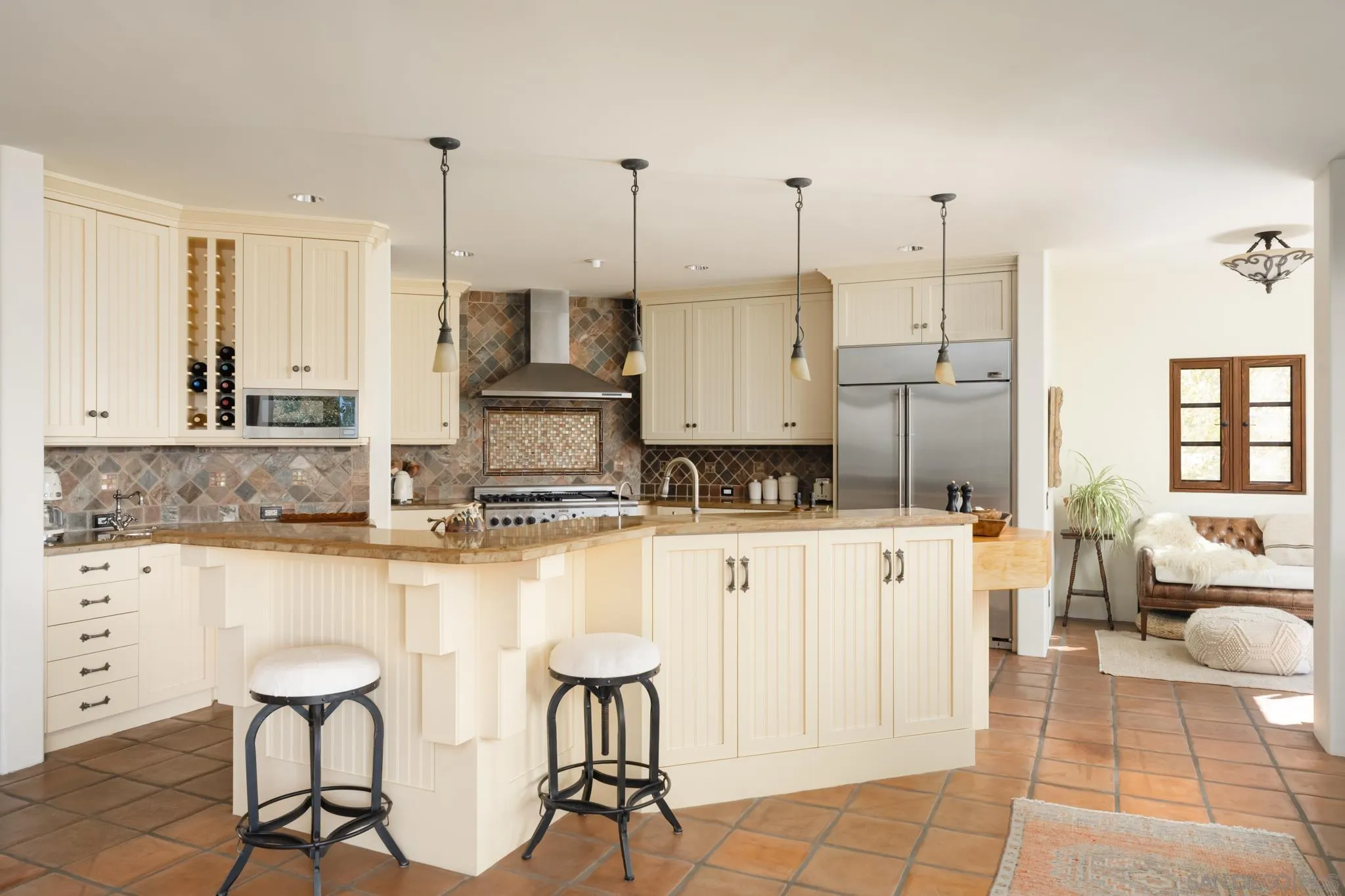 2563 Via Pisa Del Mar, CA 92014 - Photo 11 of 50 a kitchen with stainless steel appliances granite countertop a stove a sink and white cabinets