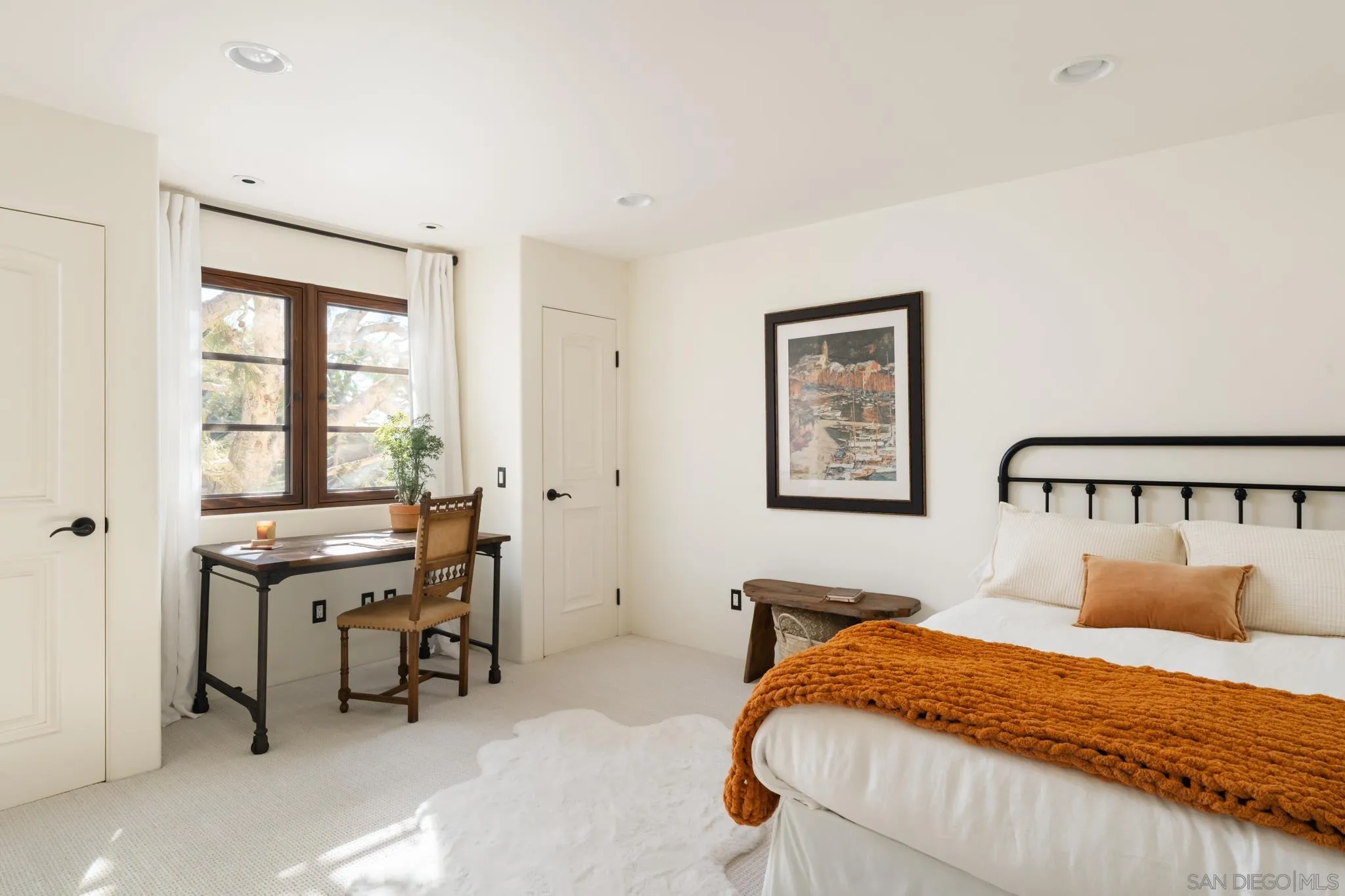 2563 Via Pisa Del Mar, CA 92014 - Photo 25 of 50 a bedroom with a bed and a window