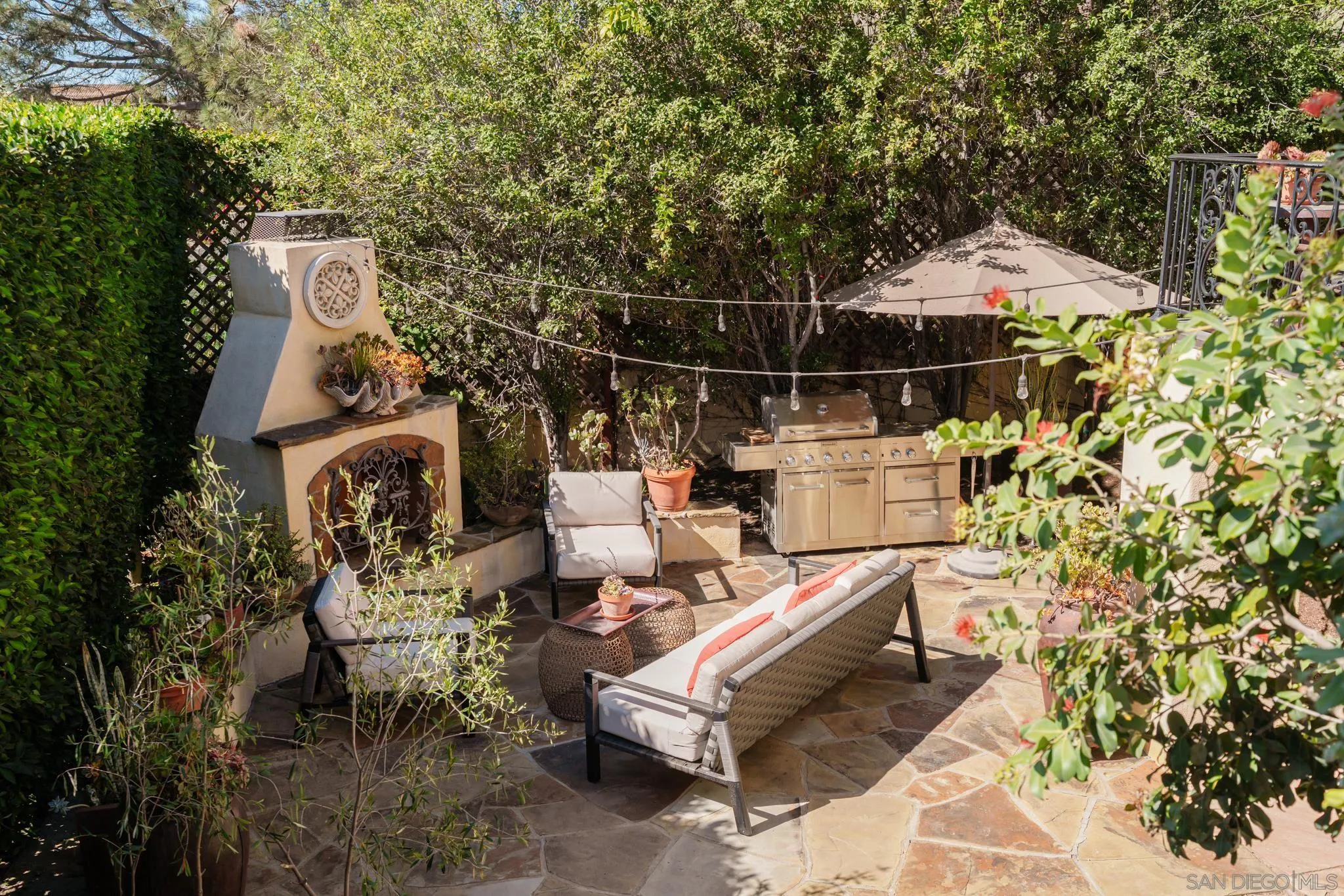 2563 Via Pisa Del Mar, CA 92014 - Photo 43 of 50 a backyard of a house with table and chairs