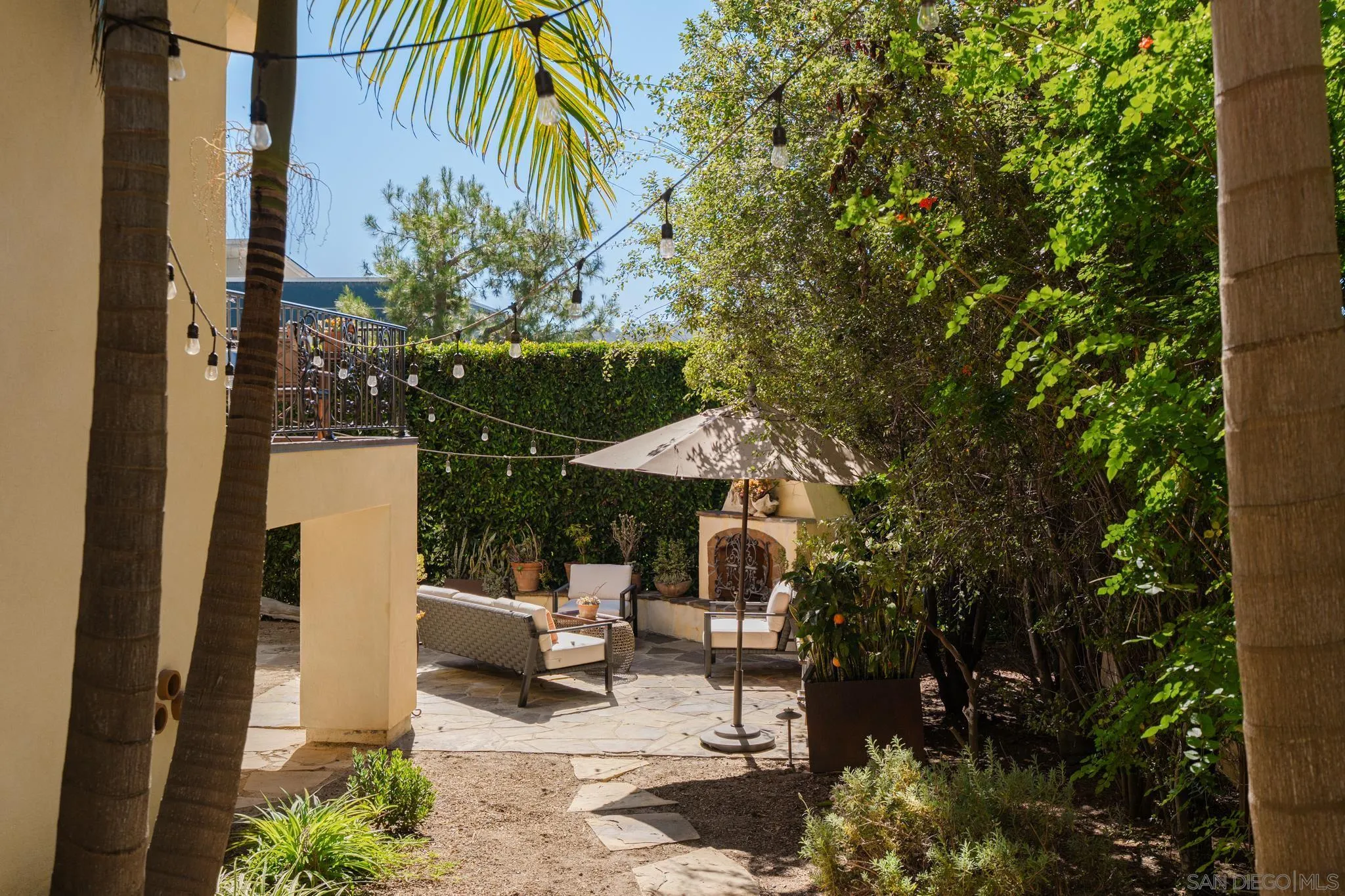 2563 Via Pisa Del Mar, CA 92014 - Photo 44 of 50 a view of a patio with table and chairs and potted plants