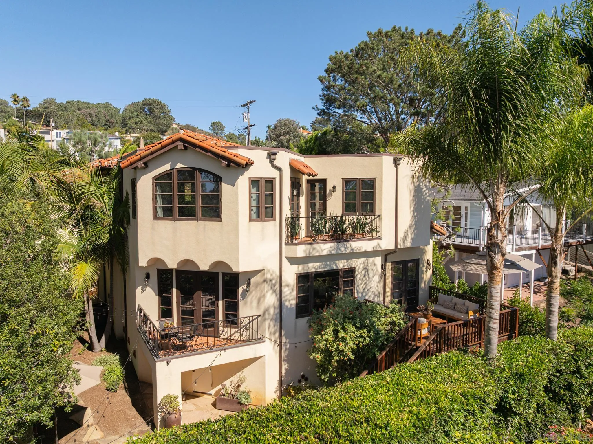 2563 Via Pisa Del Mar, CA 92014 - Photo 46 of 50 a front view of a house with a garden