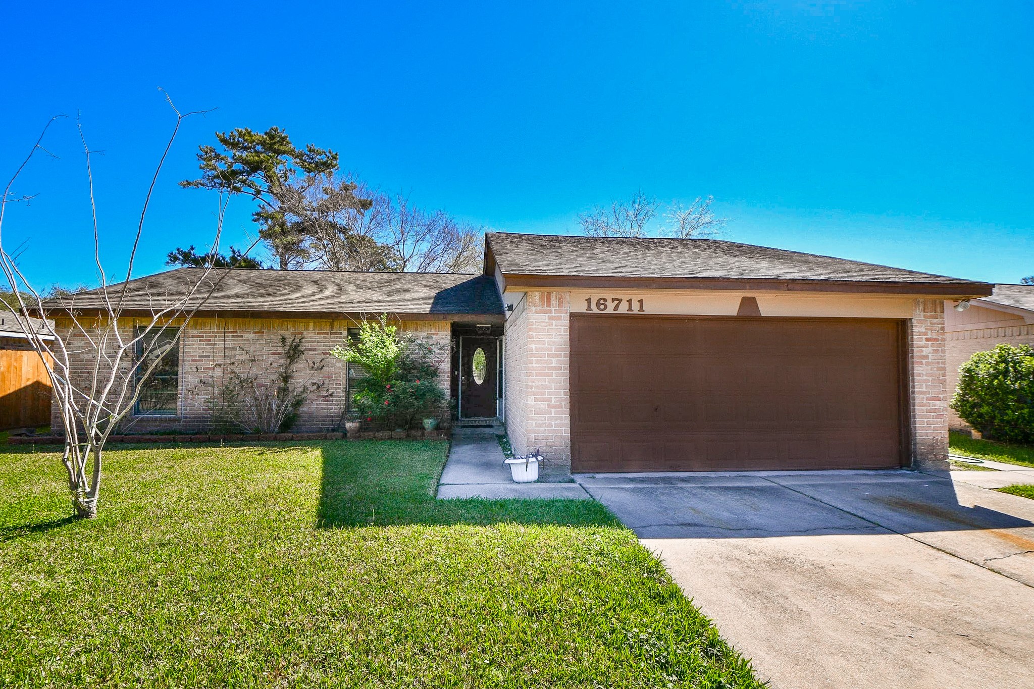 16711 Ribbonridge Drive Sugar Land, TX 77498 - Photo 2 of 24 a view of a house with a yard