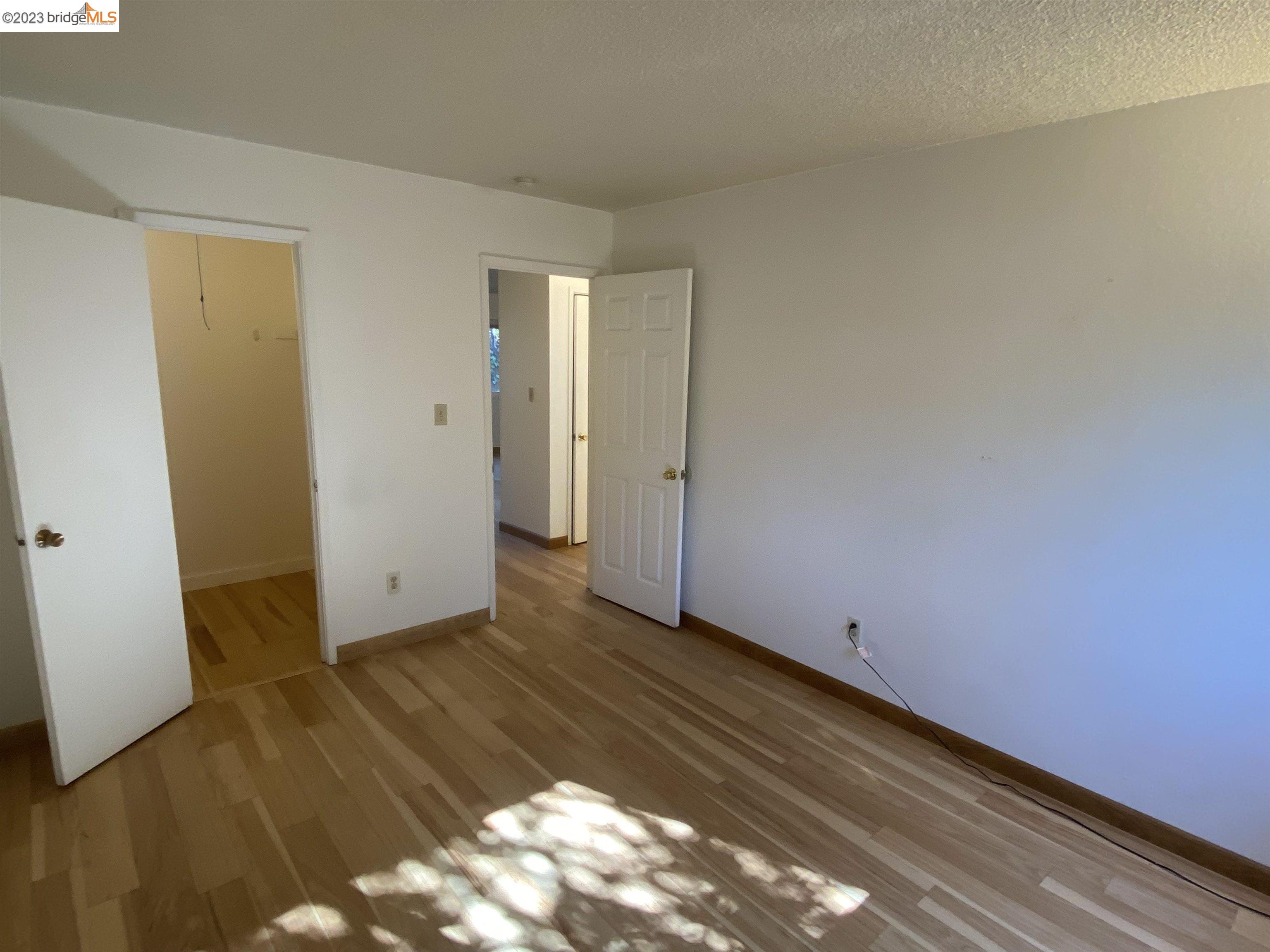 968 45th Street, Unit A Oakland, CA 94608 - Photo 15 of 16 a view of room with wooden floor