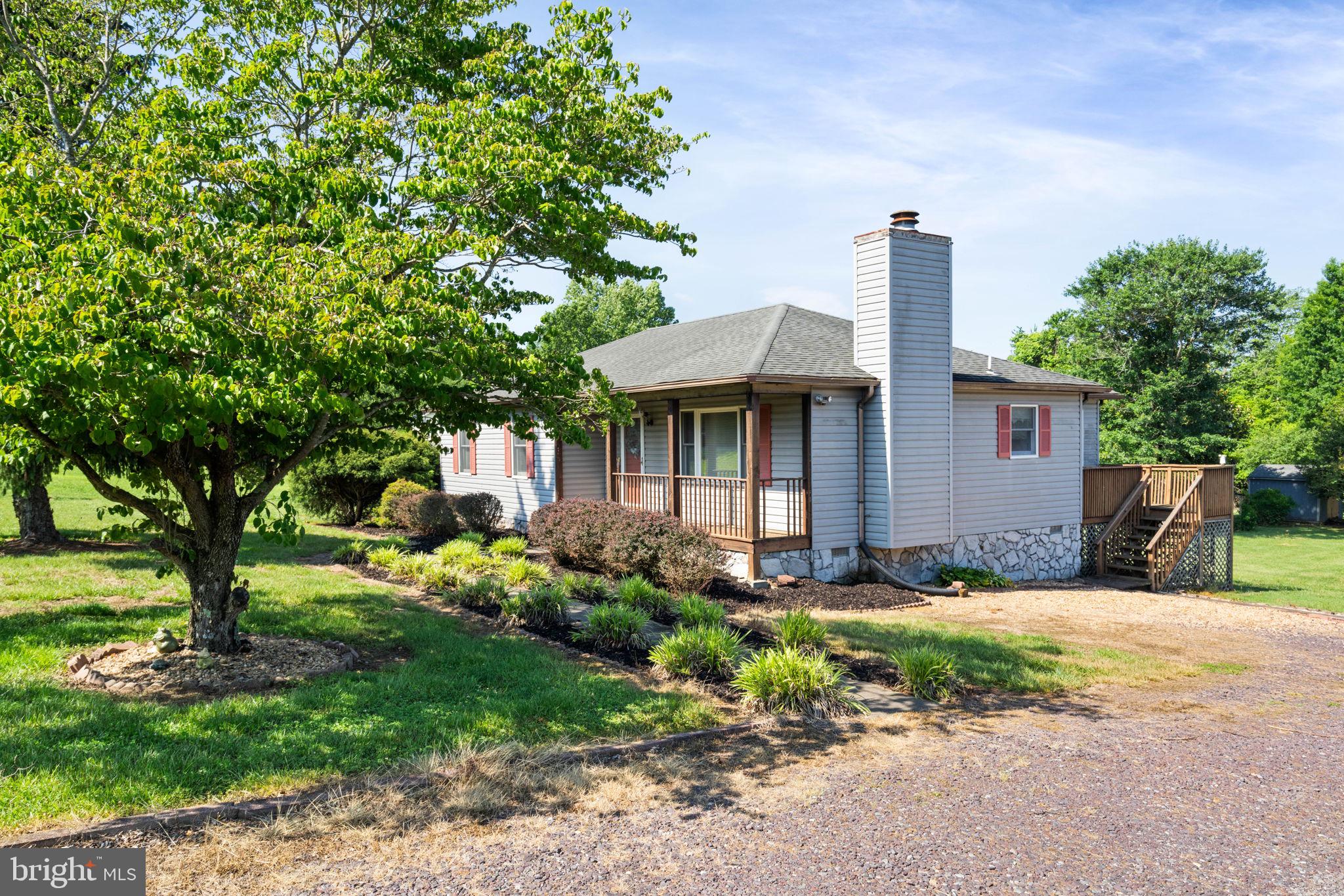 161 Troy Road Louisa, VA 23093 - Photo 12 of 60 a front view of a house with garden