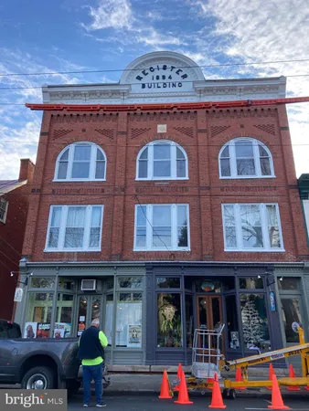 a front view of a building with many windows