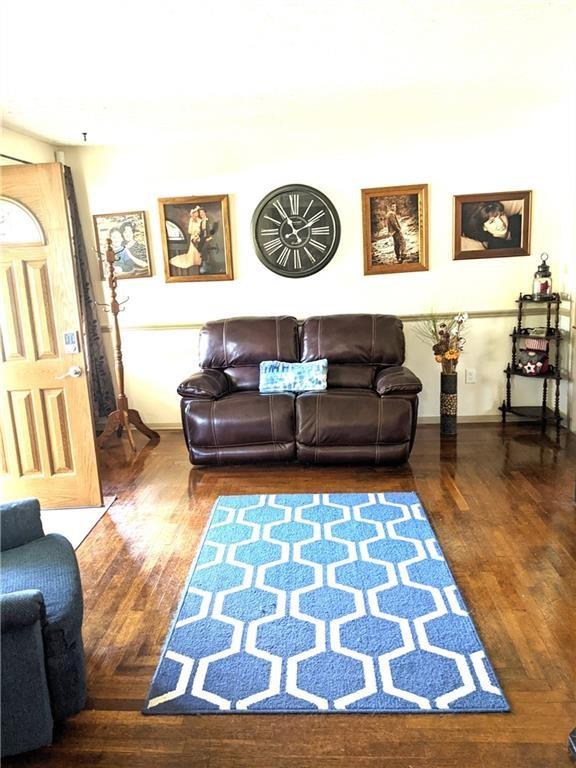 3067 Hadley Road Hadley, PA 16130 - Photo 3 of 18 a living room with a rug and couch